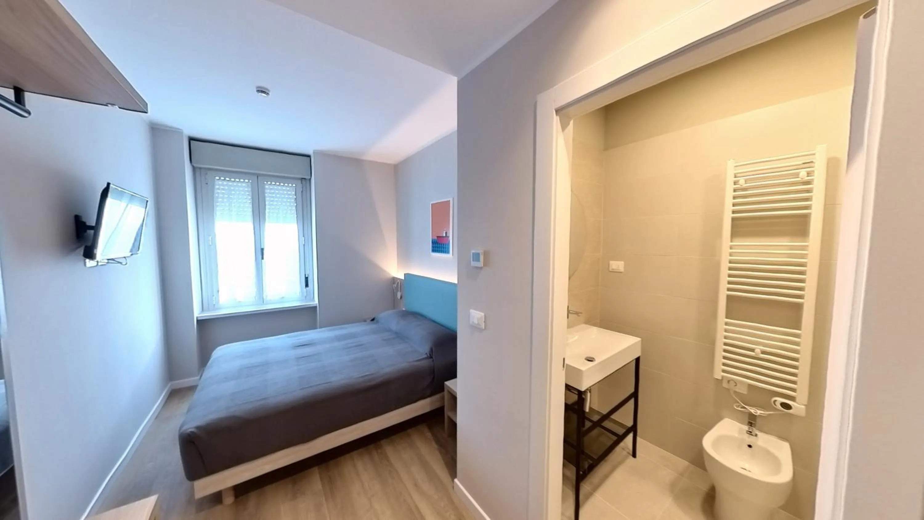 Bed in Hotel Tritone