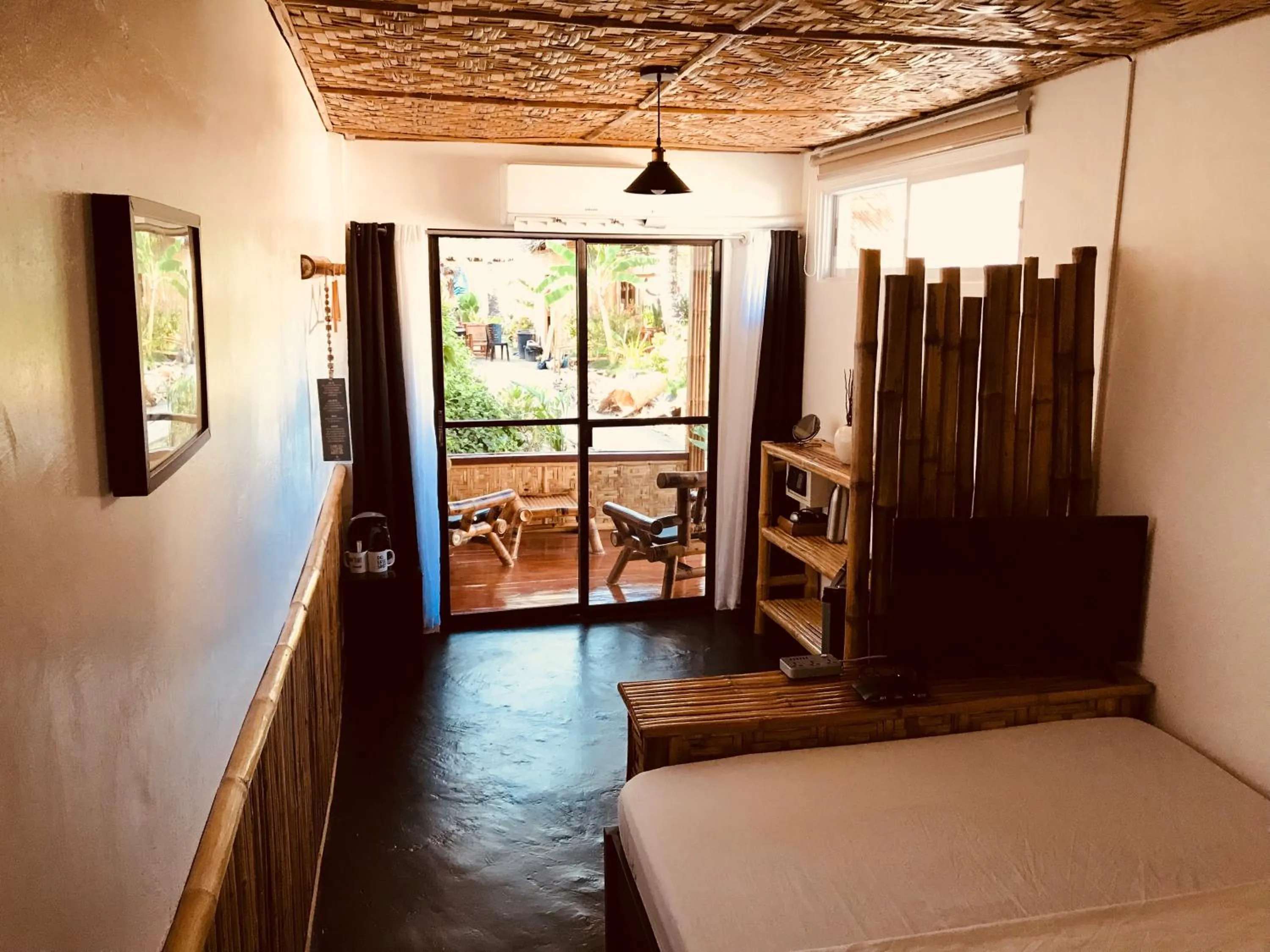 Patio, Bed in Everyday Sunday Formerly Carl's Island Inn