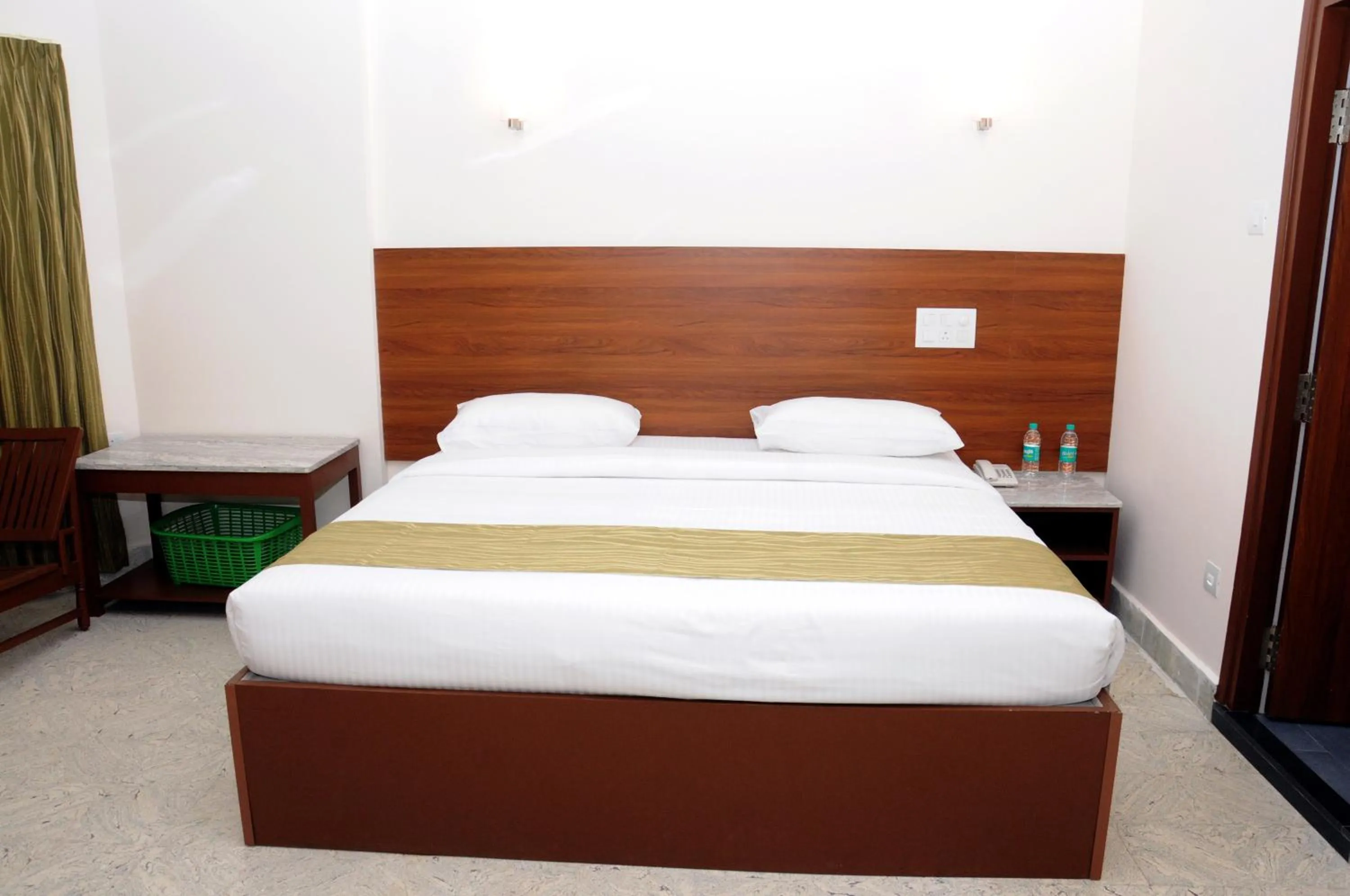 Bed in Sreeparthi Hotel
