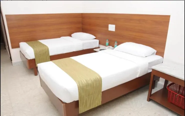 Bed in Sreeparthi Hotel