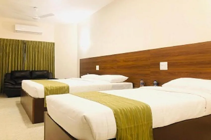 Bed in Sreeparthi Hotel