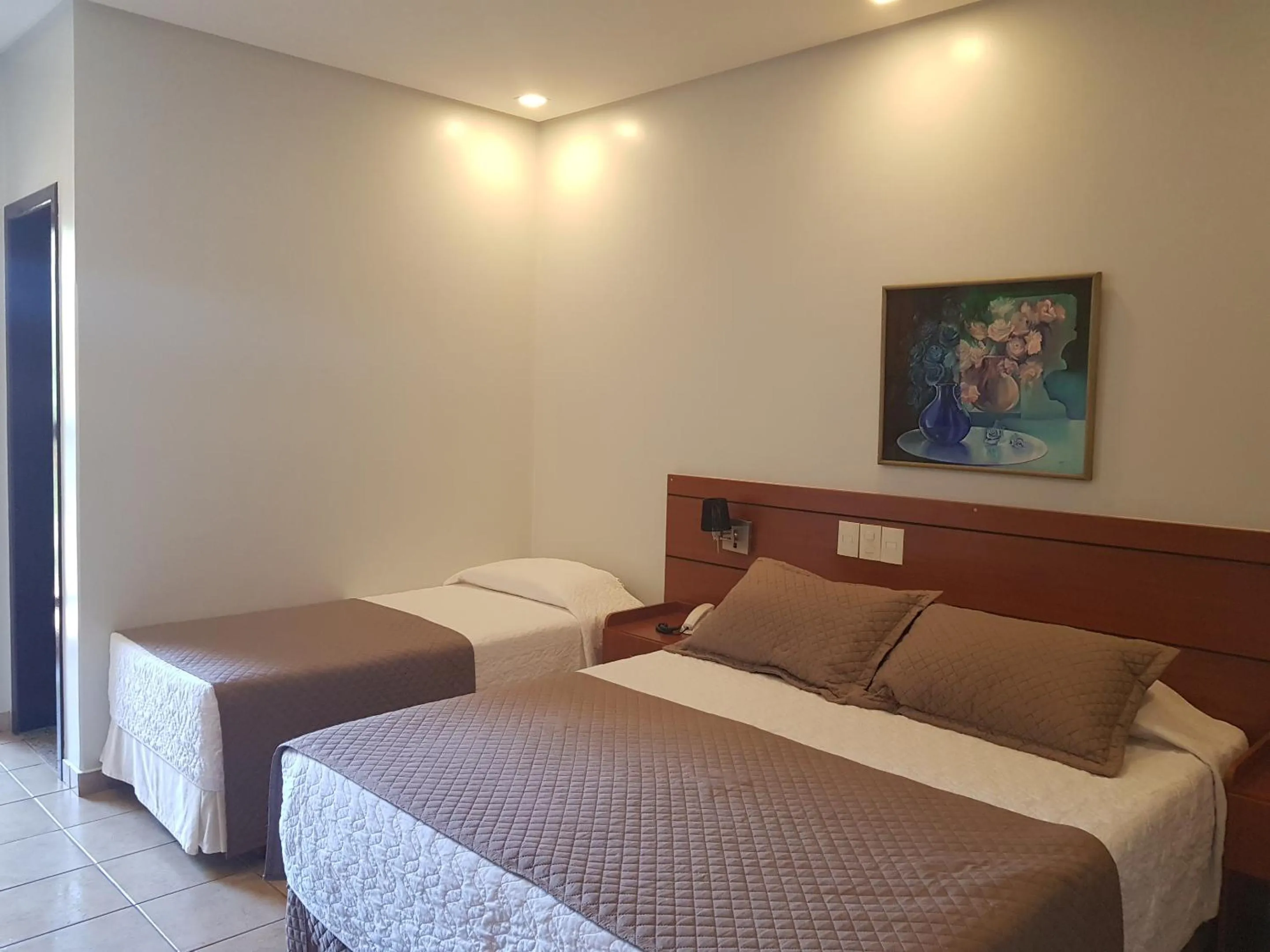 Bed in Hotel das Palmeiras