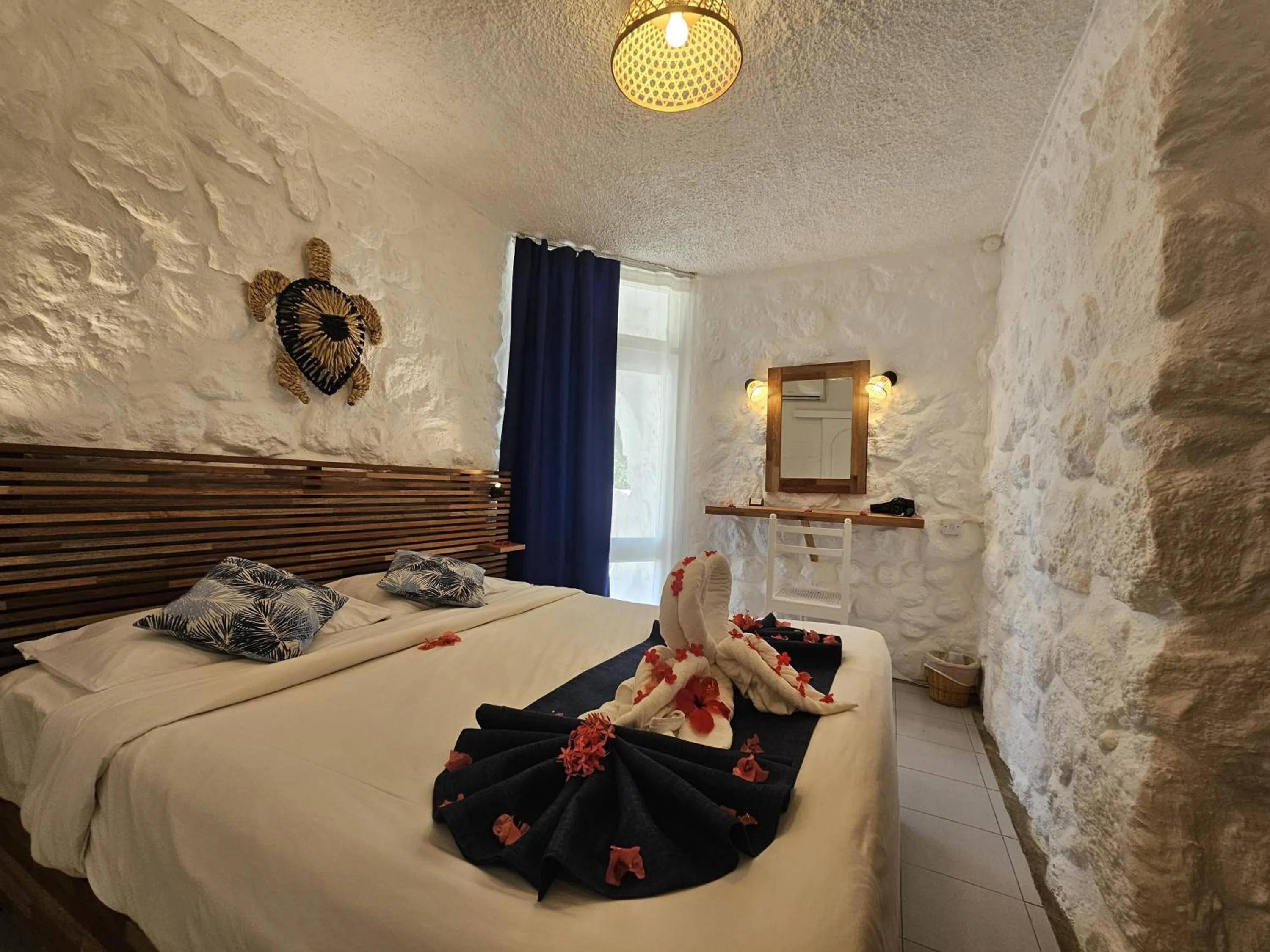 Bed in Casuarina Resort and Spa