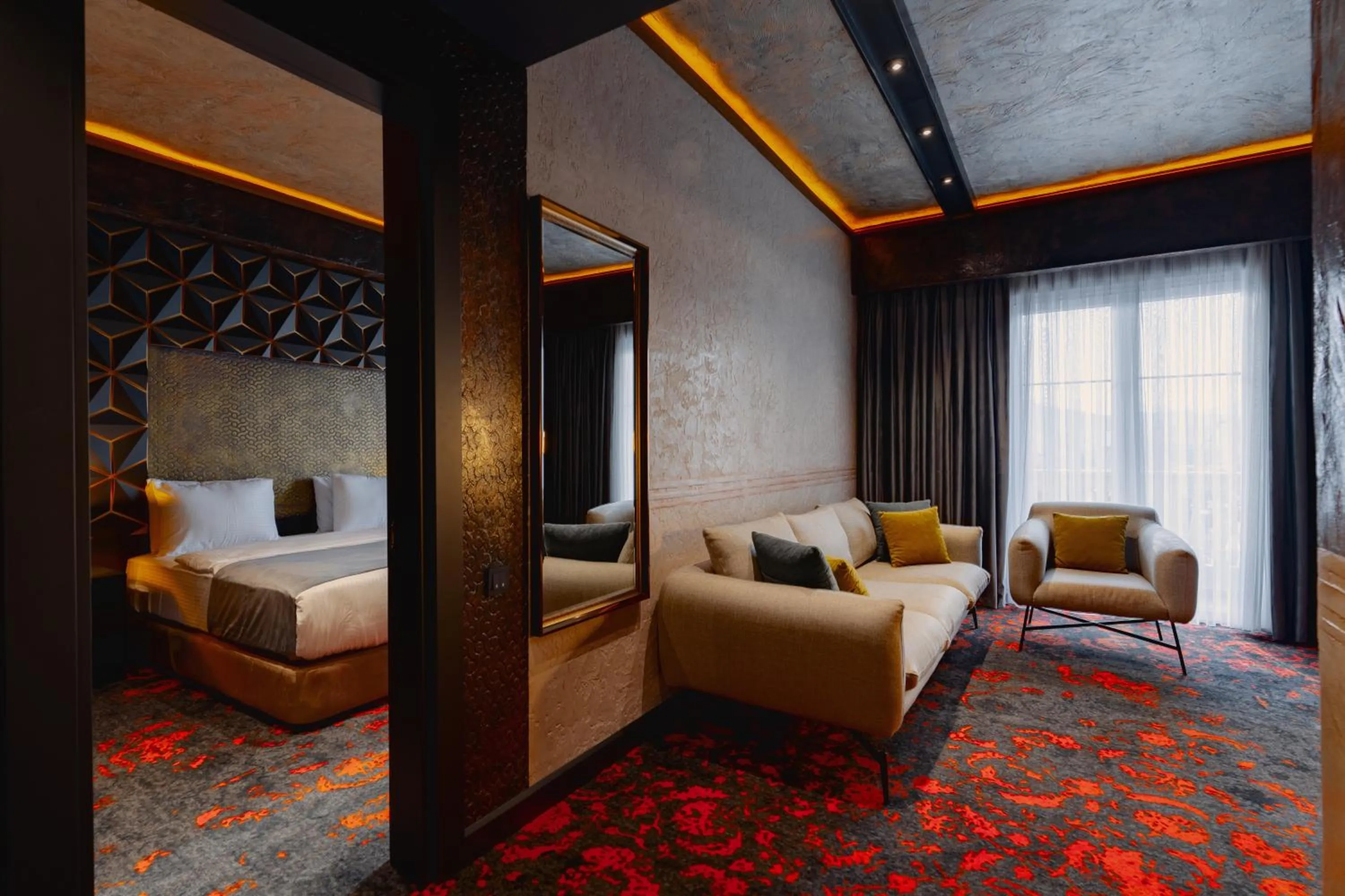 Seating area, Bed in Tapis Rouge Design Boutique Hotel