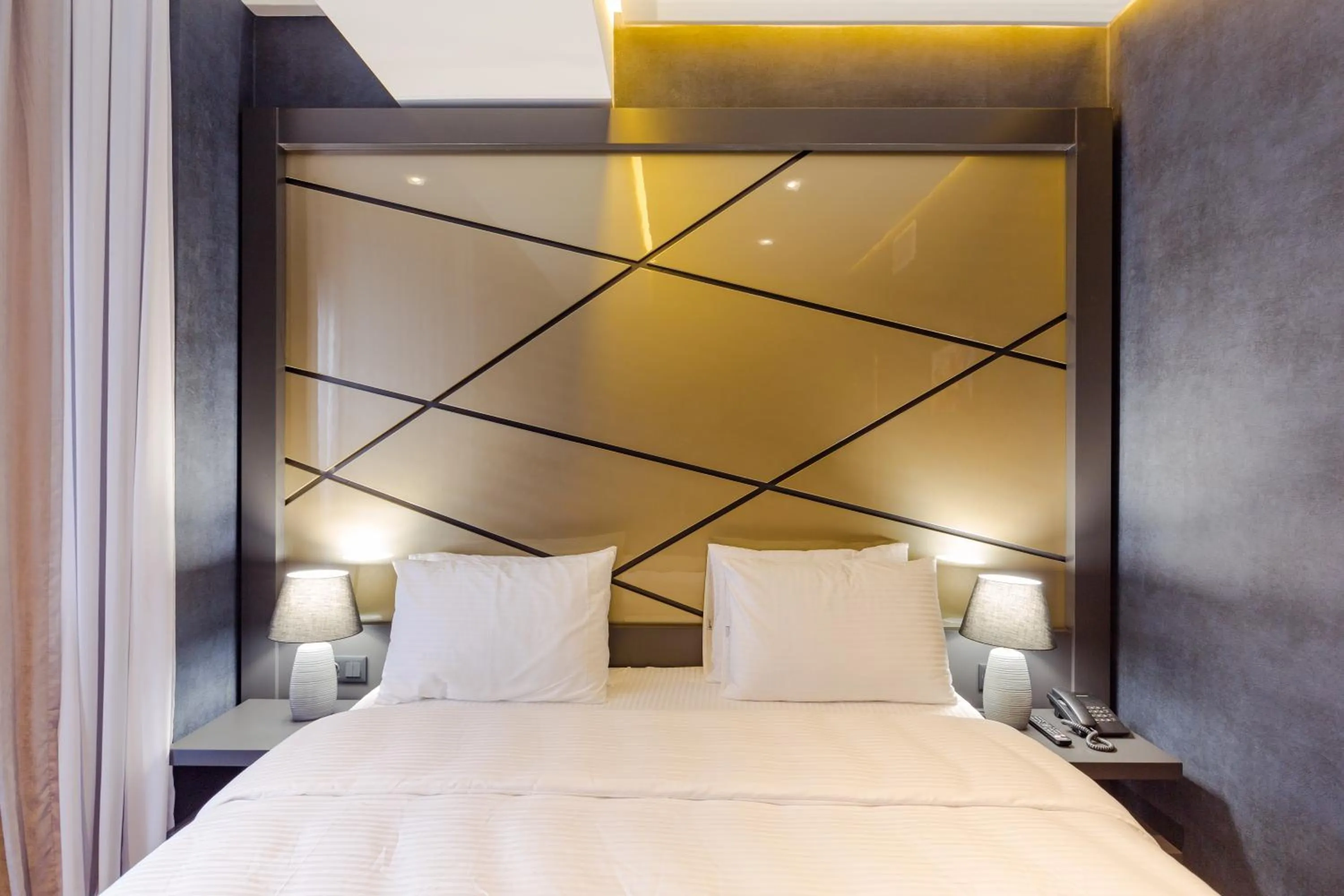 Bed in Tapis Rouge Design Boutique Hotel