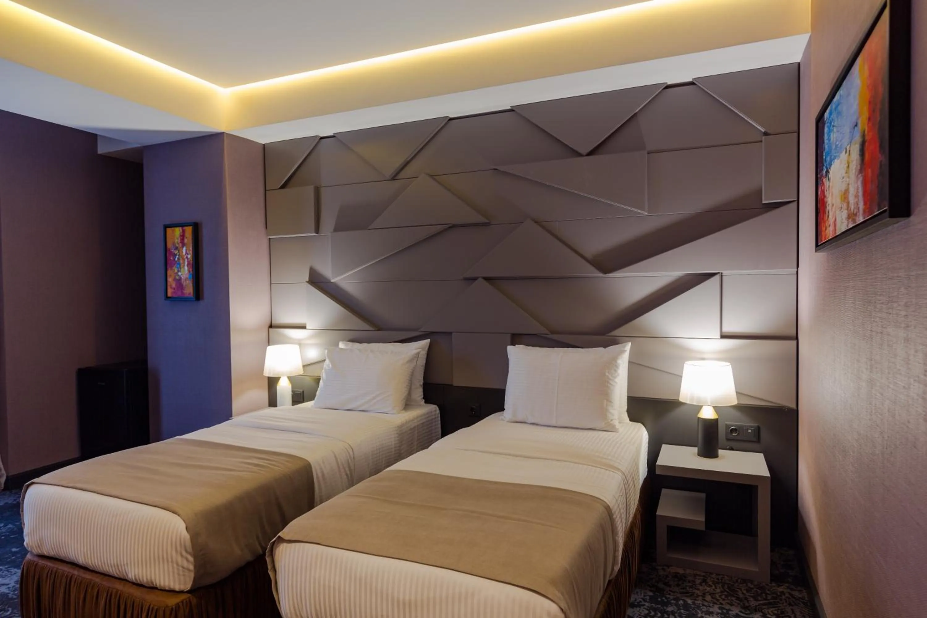 Bed in Tapis Rouge Design Boutique Hotel