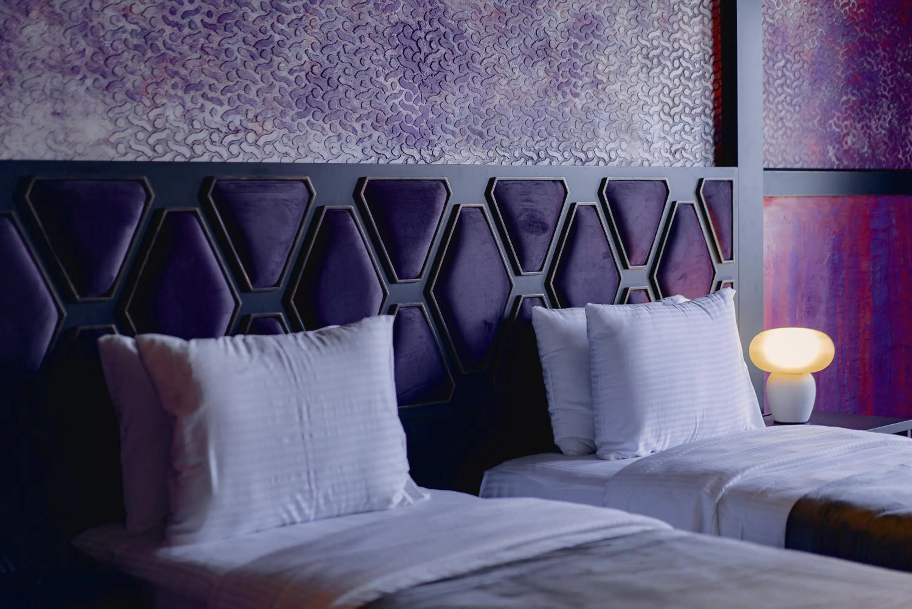 Bed in Tapis Rouge Design Boutique Hotel