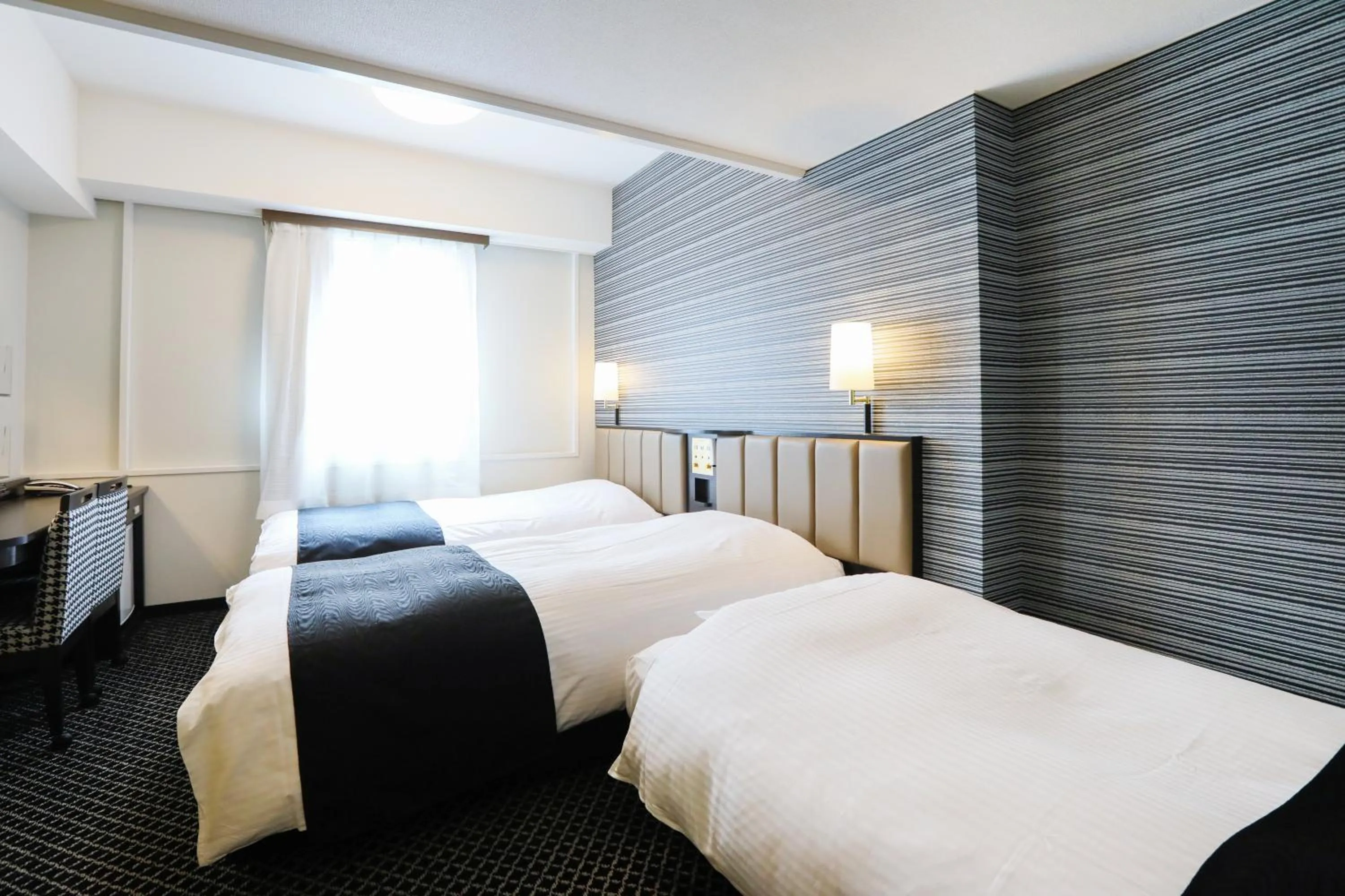 Photo of the whole room, Bed in APA Hotel Sapporo Susukino Ekimae