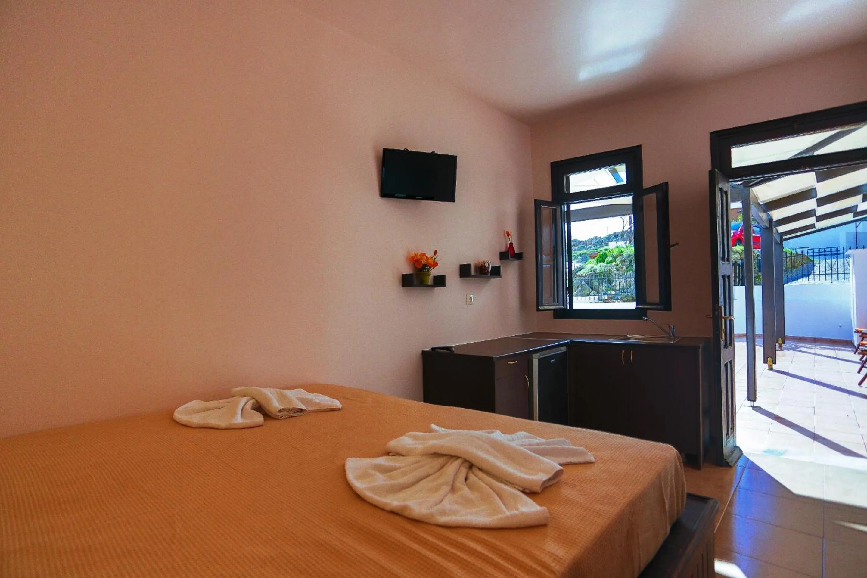 Bed in Little Lindos Sea View Studios