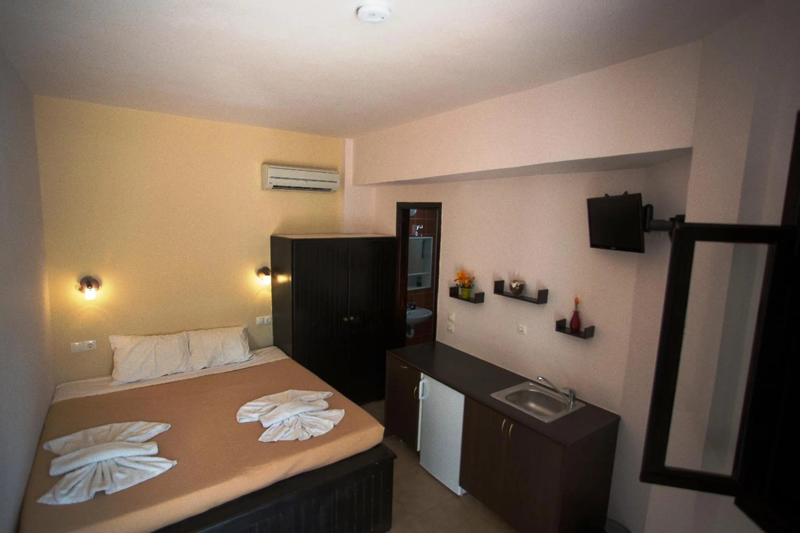 Bed in Little Lindos Sea View Studios