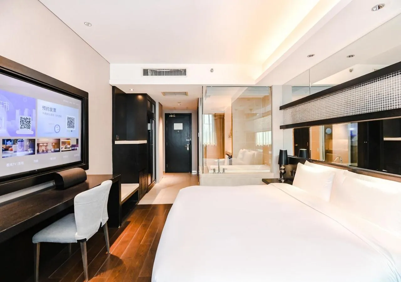 Communal lounge/ TV room, Bed in Crystal Orange Hotel Shanghai Kangqiao Branch