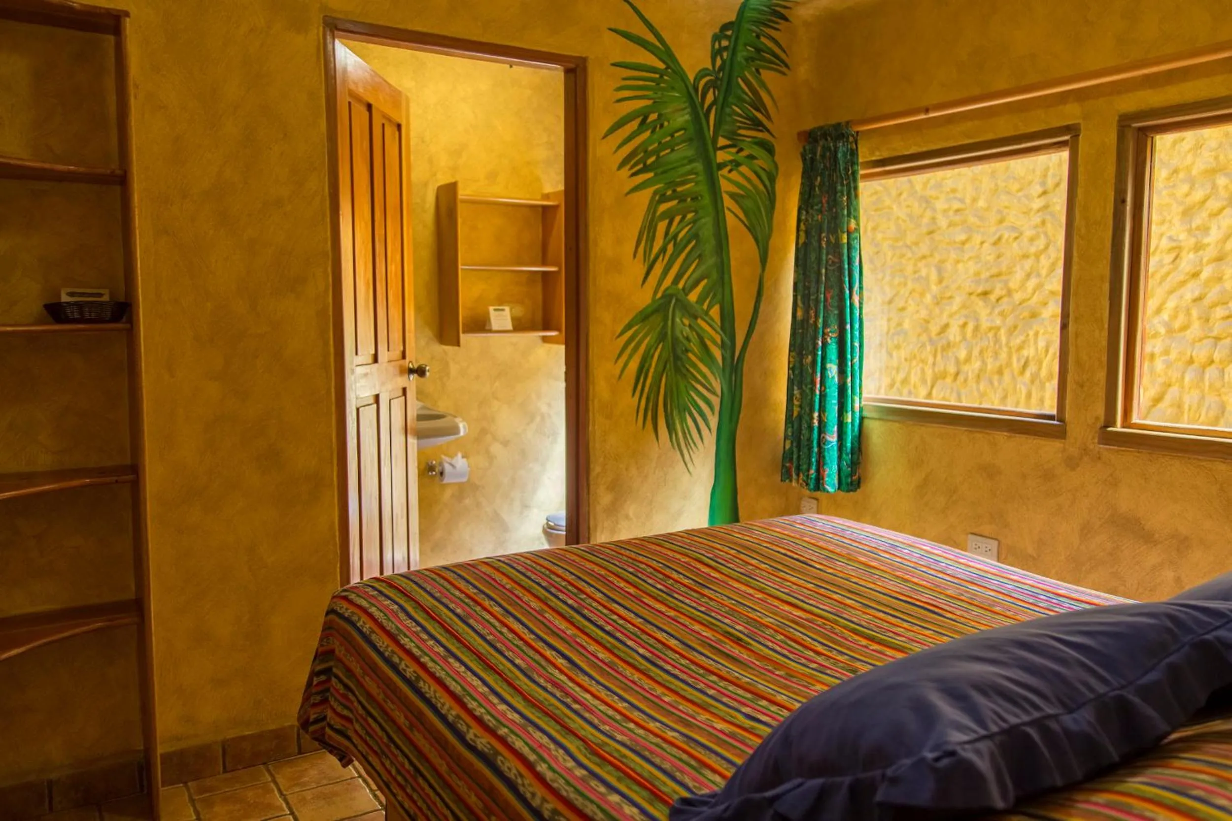 Bed in El Sano Banano Beachside Hotel