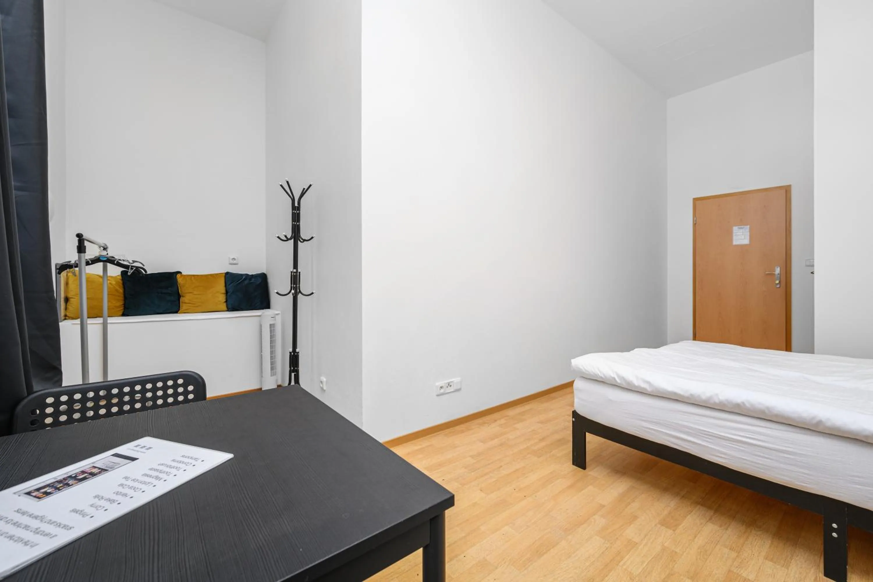 Seating area, Bed in Wellness Rooms Central