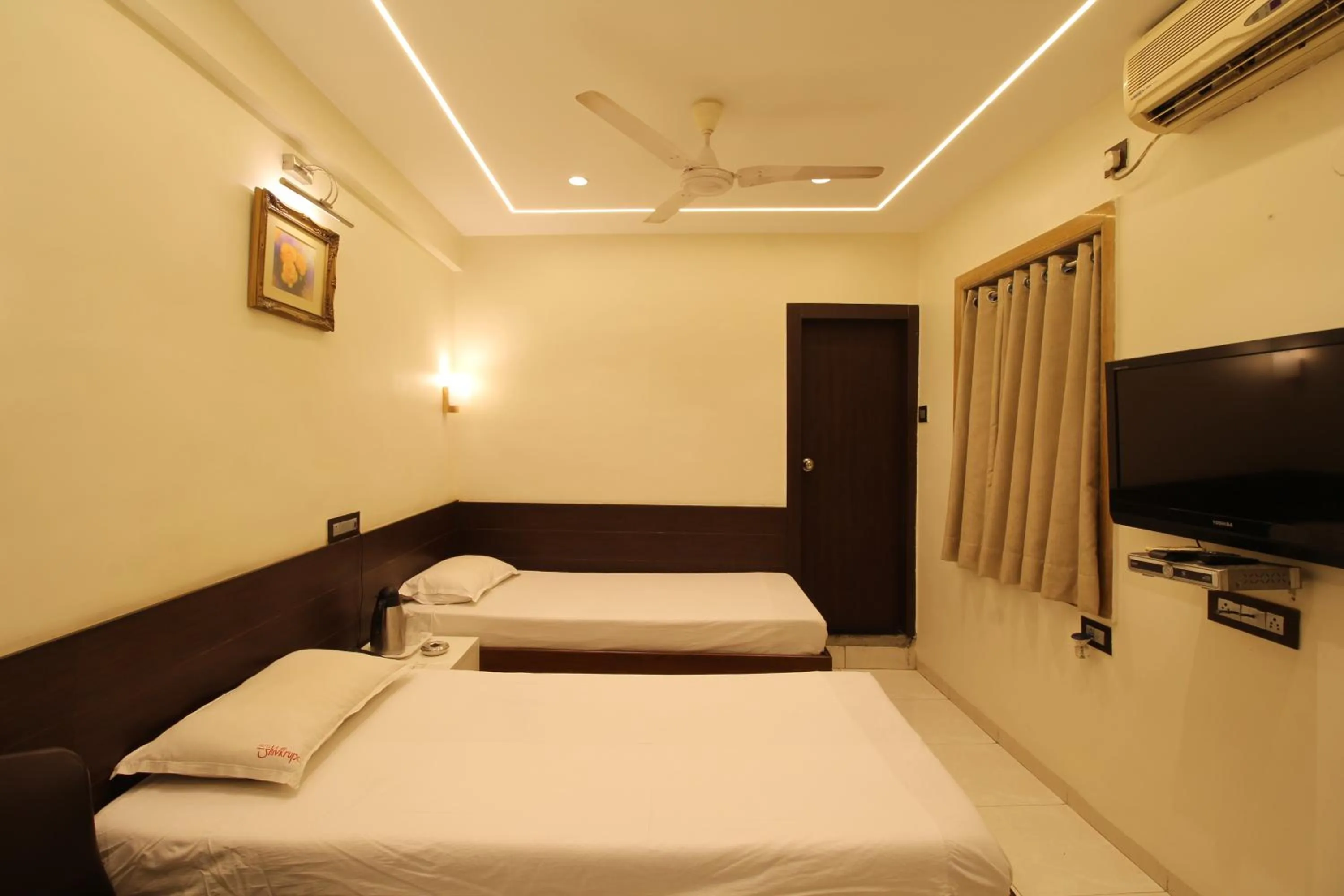 Photo of the whole room, Bed in Hotel Shivkrupa