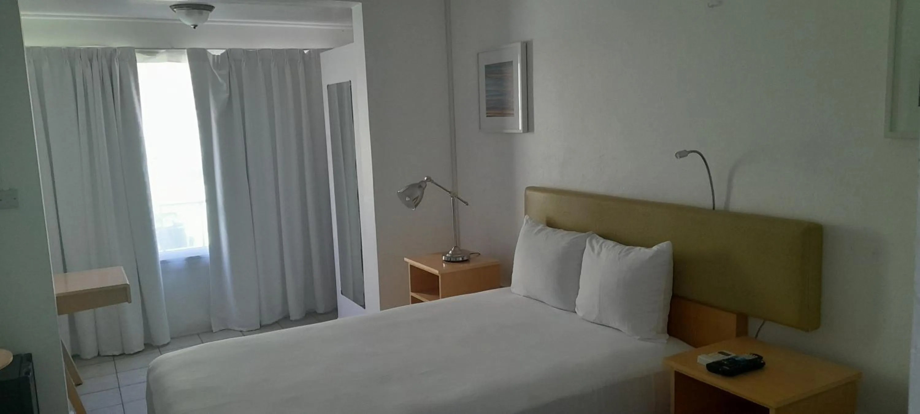 Bed in Ocean's Edge Lodge Restaurant & Bar