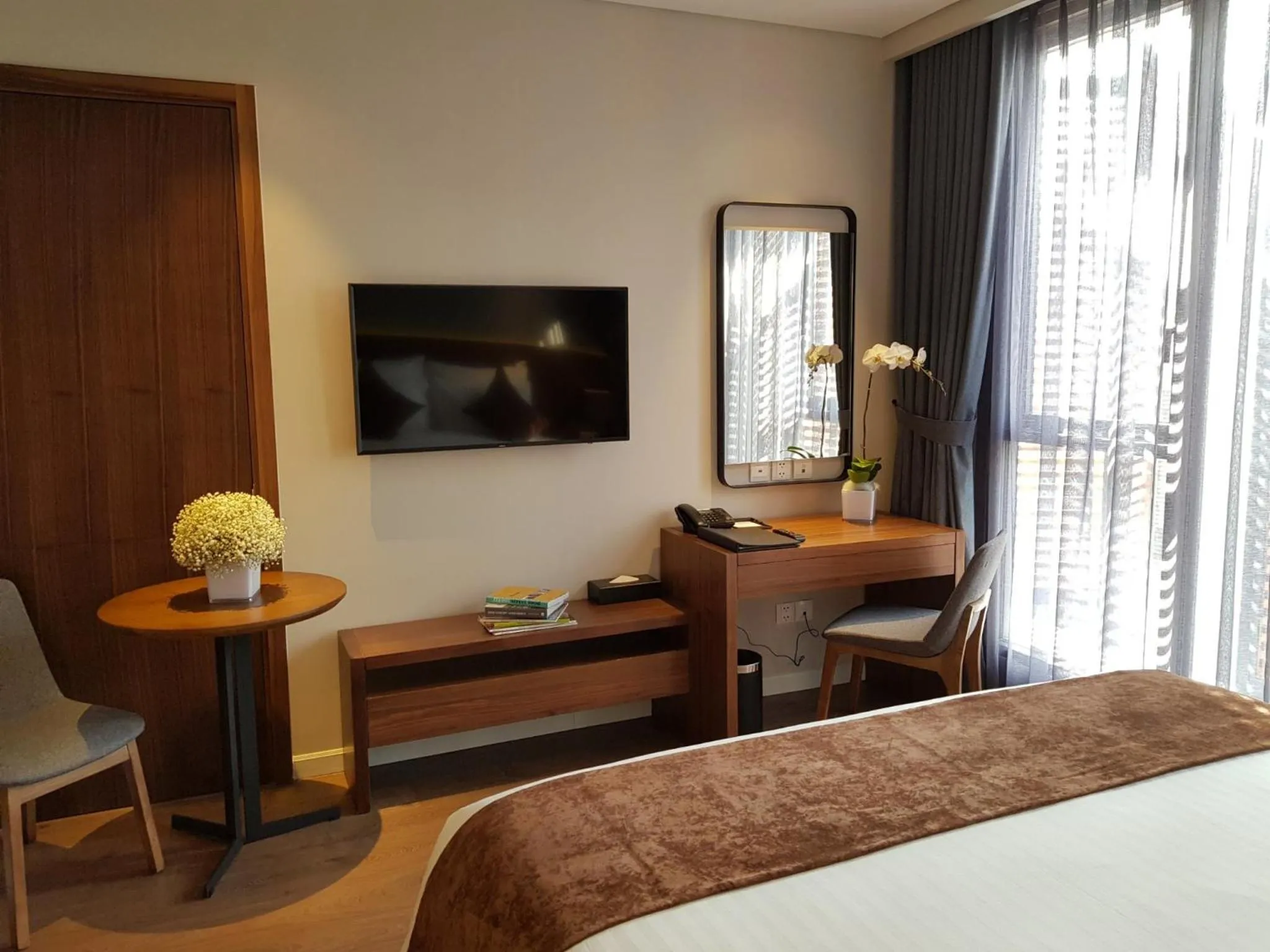 Bed in Orchid Boutique Hotel & Apartment