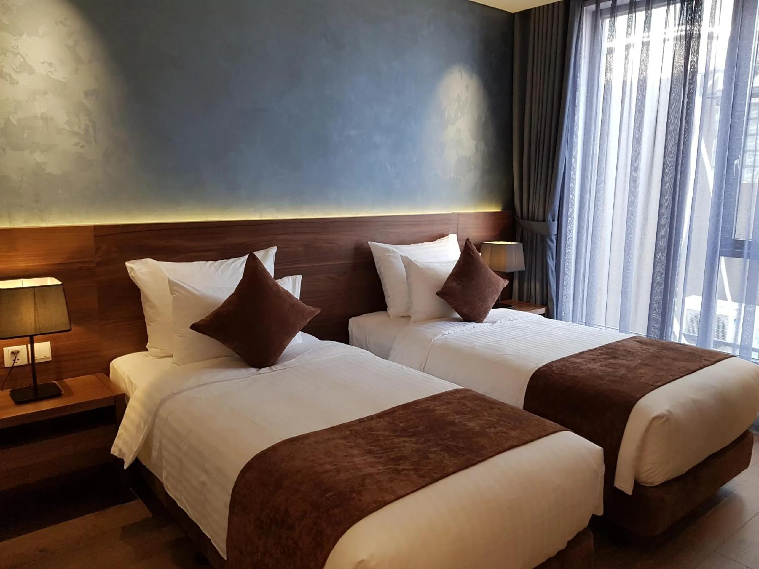 Bed in Orchid Boutique Hotel & Apartment