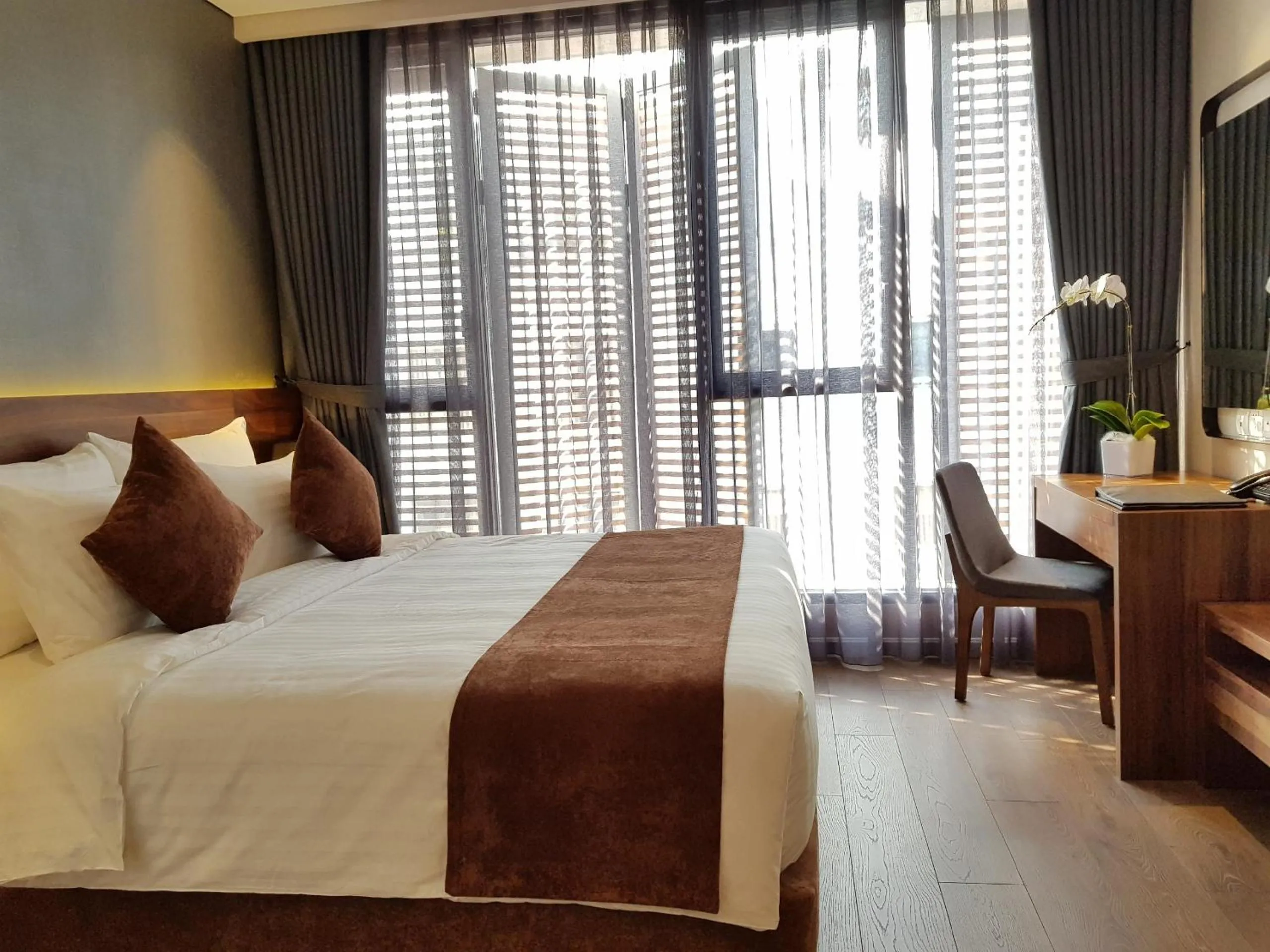 Bed in Orchid Boutique Hotel & Apartment