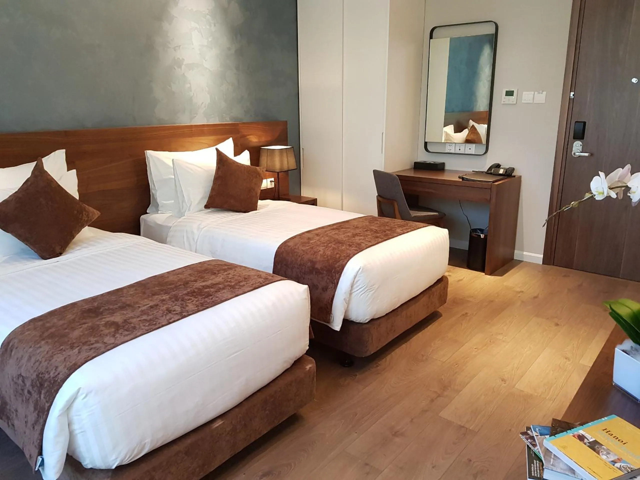 Bed in Orchid Boutique Hotel & Apartment