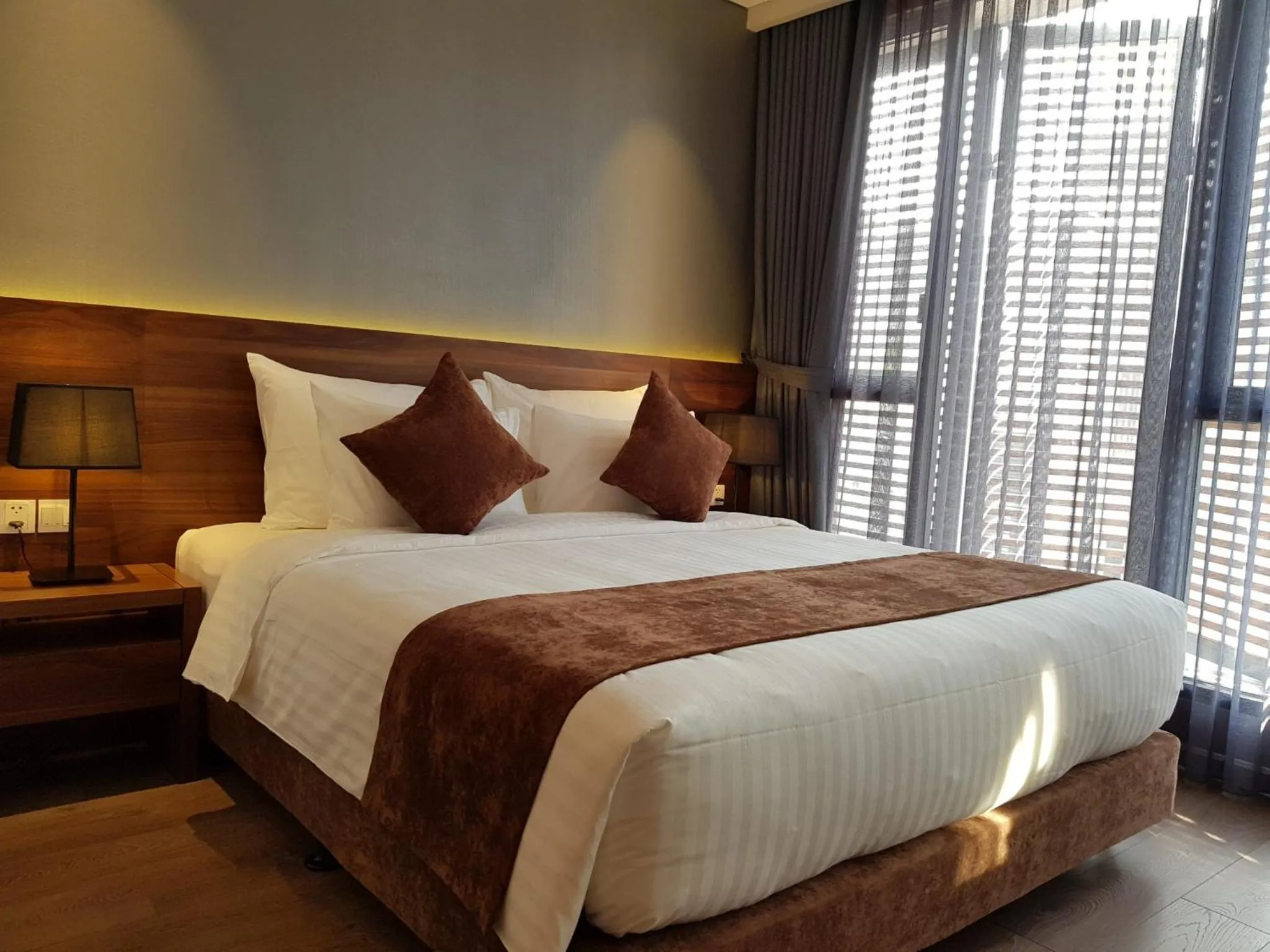 Bed in Orchid Boutique Hotel & Apartment