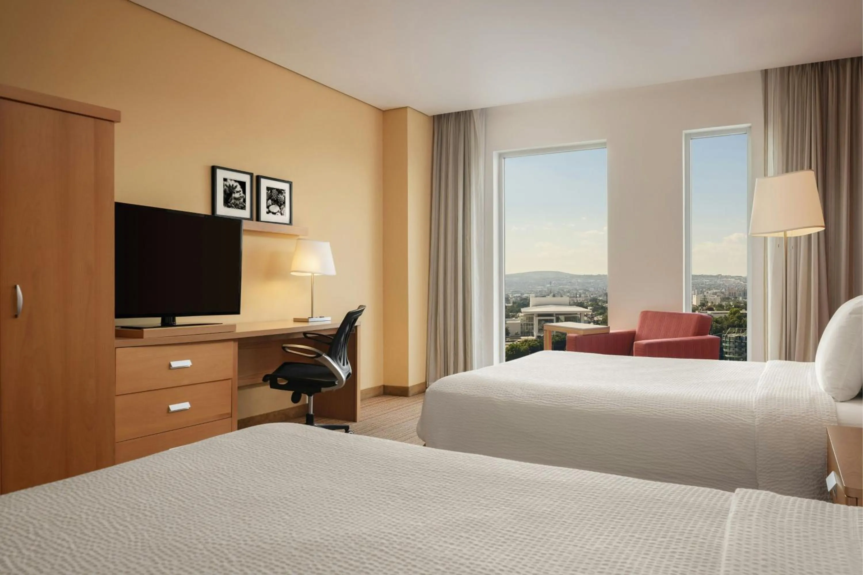 Photo of the whole room, Bed in Courtyard by Marriott Leon at The Poliforum