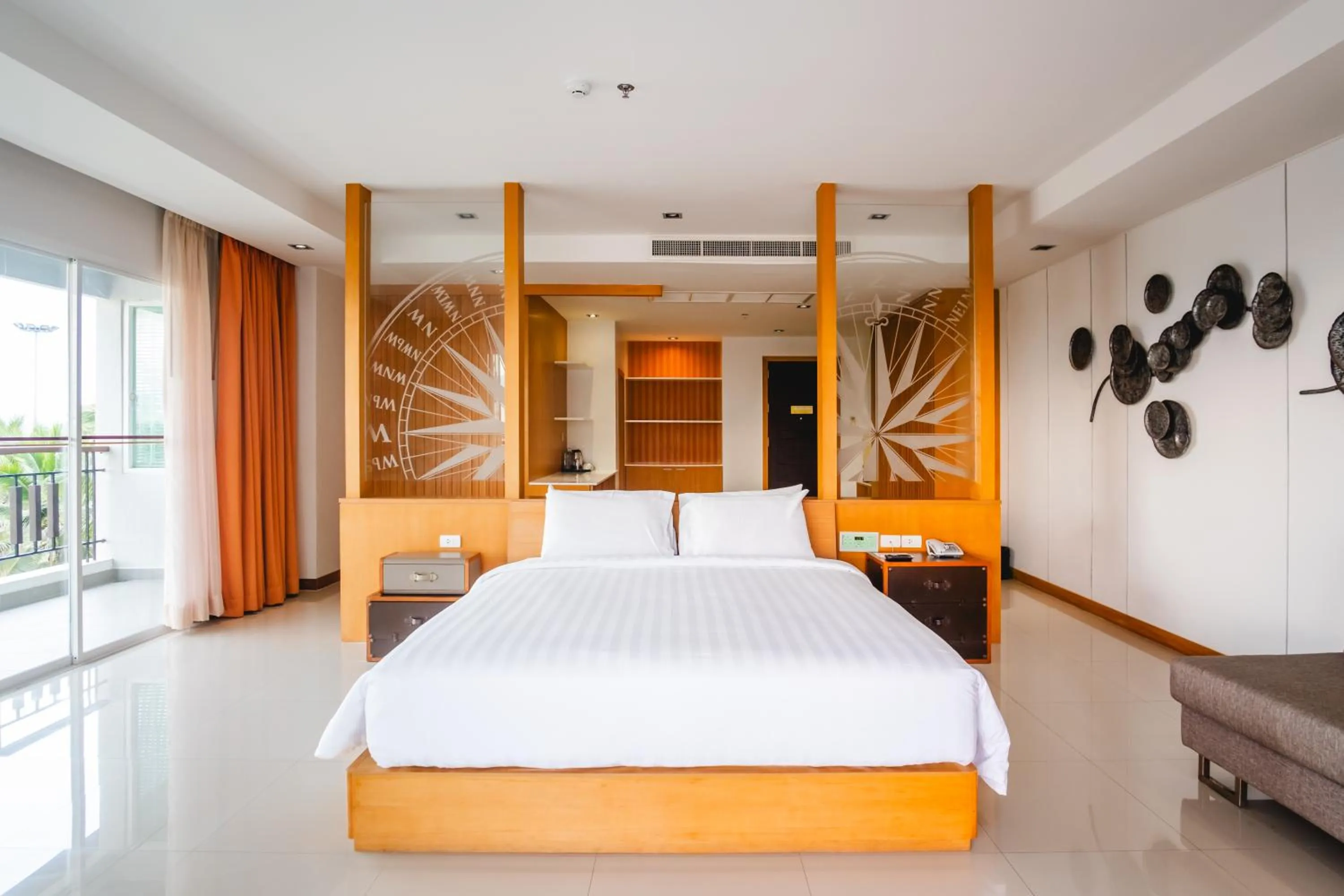 Bed in Welcome World Beachfront Resort