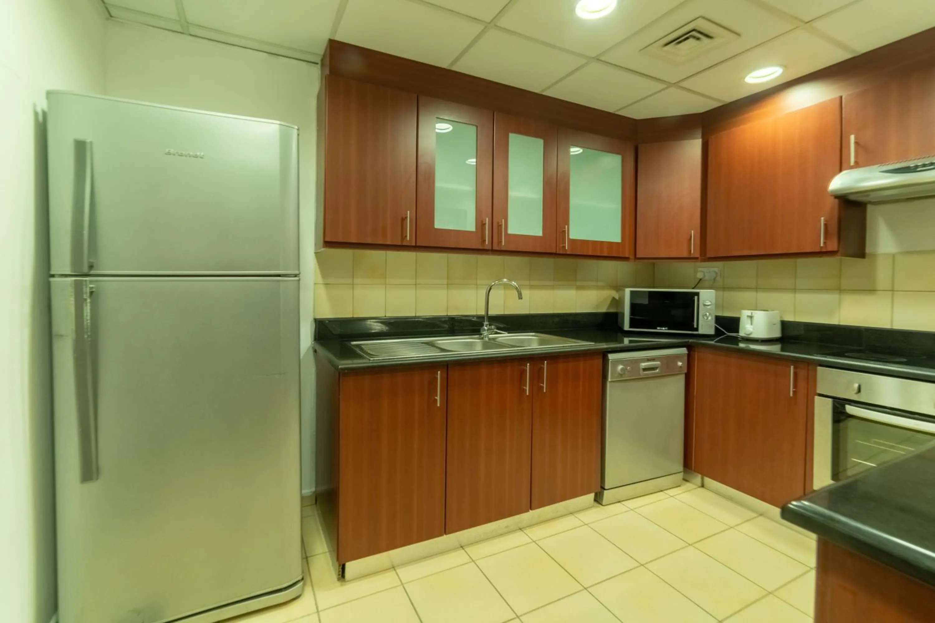 Kitchen or kitchenette in SUHA JBR Hotel Apartments