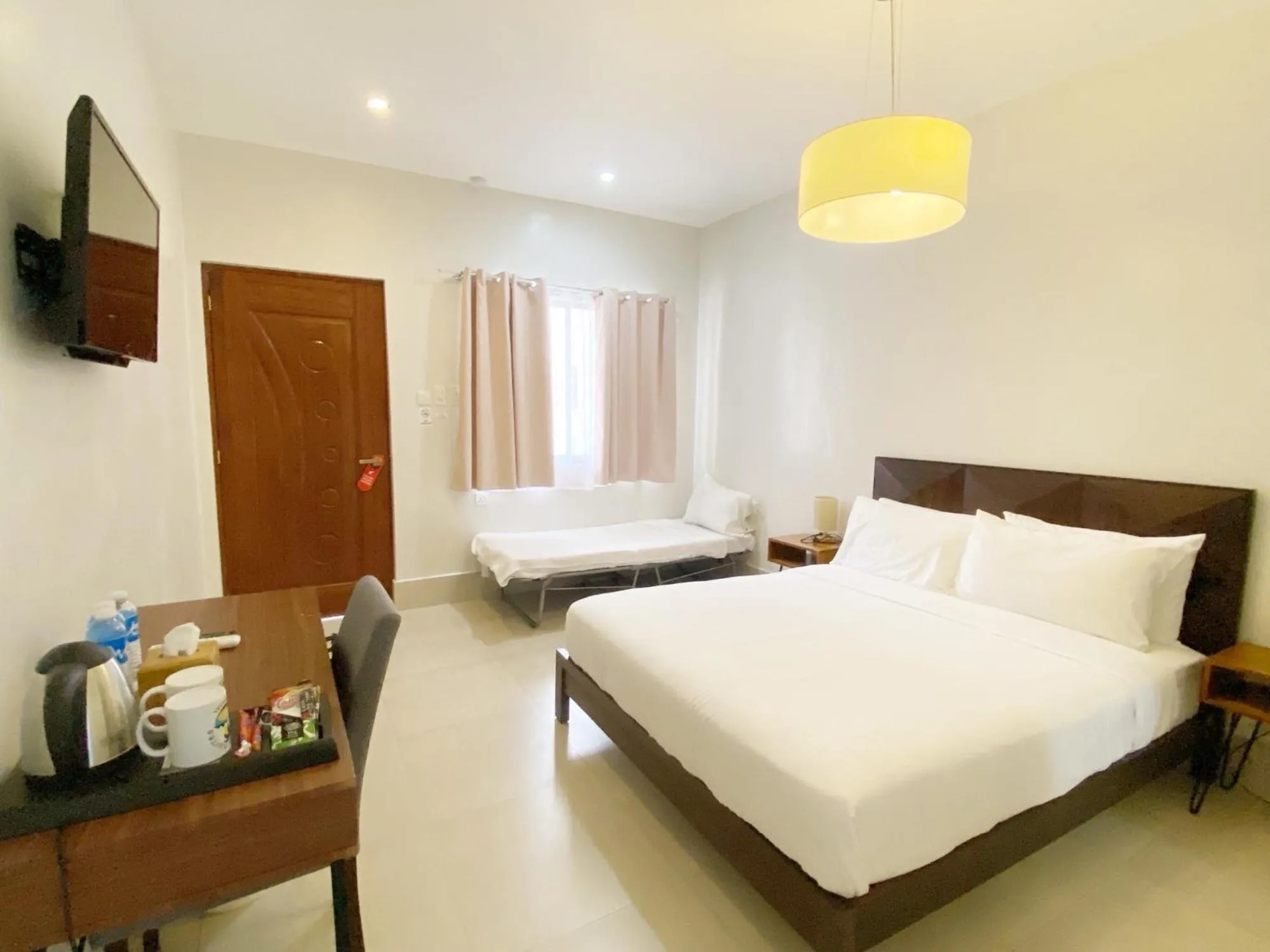 Bed in HARMAN SUITES Moalboal