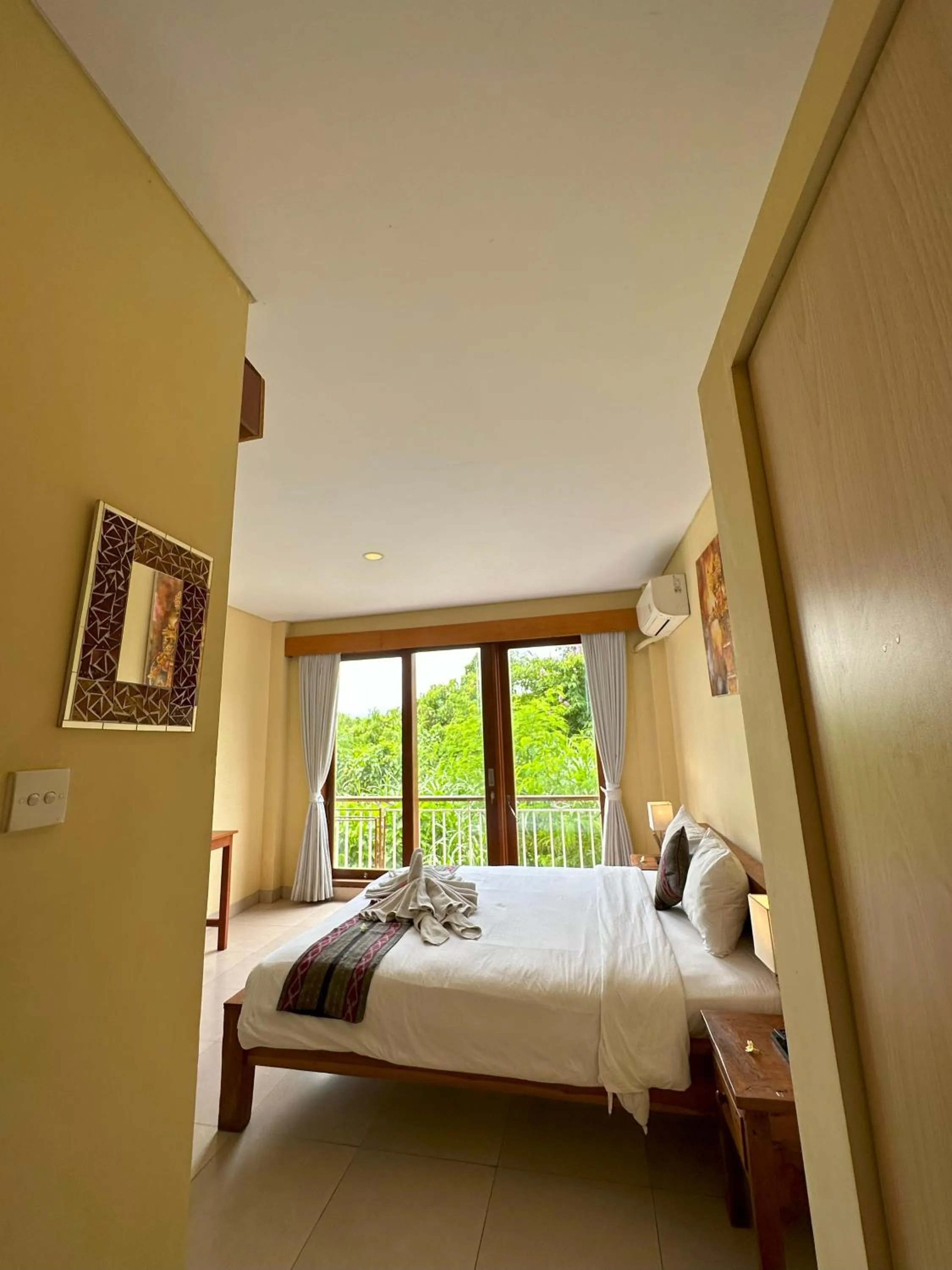 Bed in Oka's Guest House Canggu