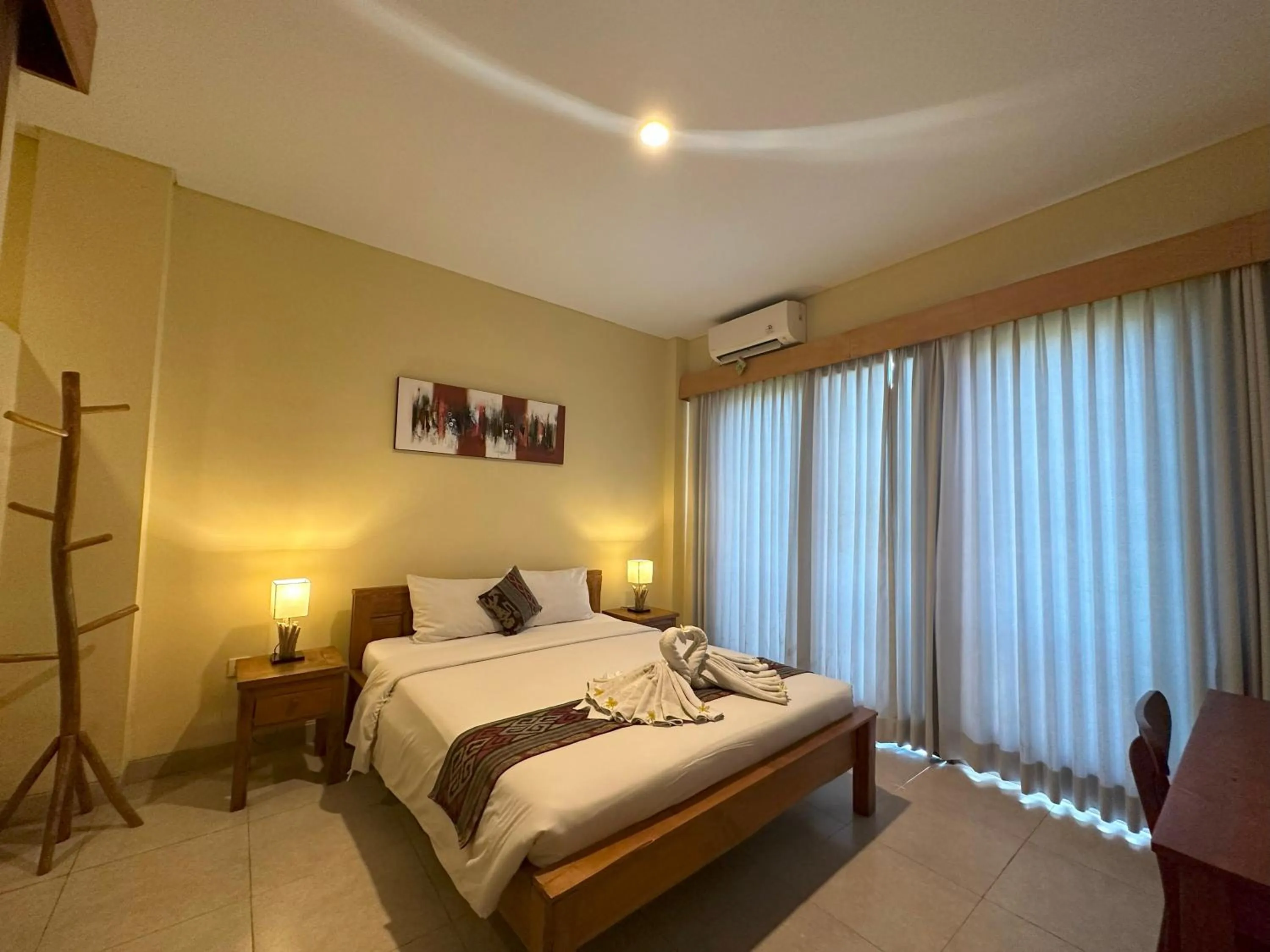 Bed in Oka's Guest House Canggu