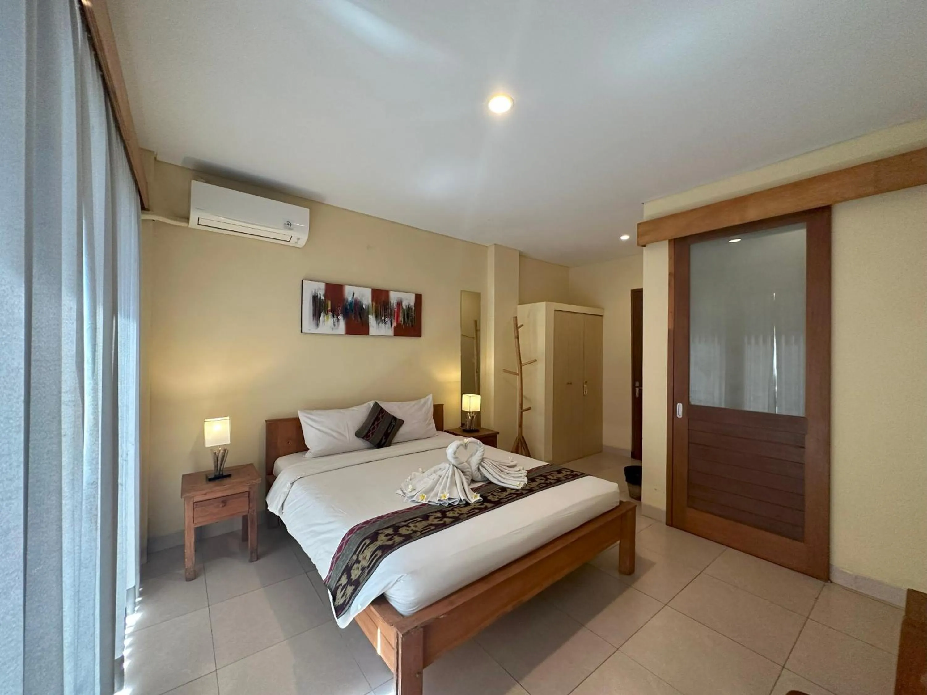 Bed in Oka's Guest House Canggu