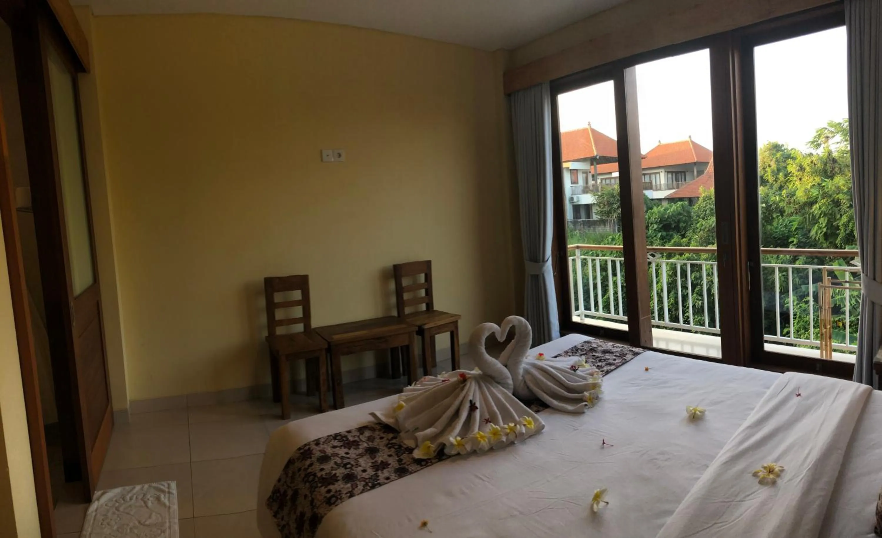 Bed in Oka's Guest House Canggu