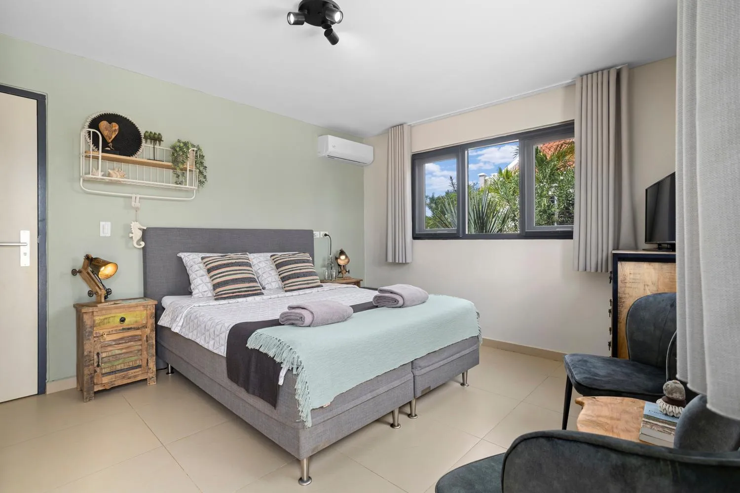 air conditioner, Bed in Oasis guesthouse, Boutique Style Hotel