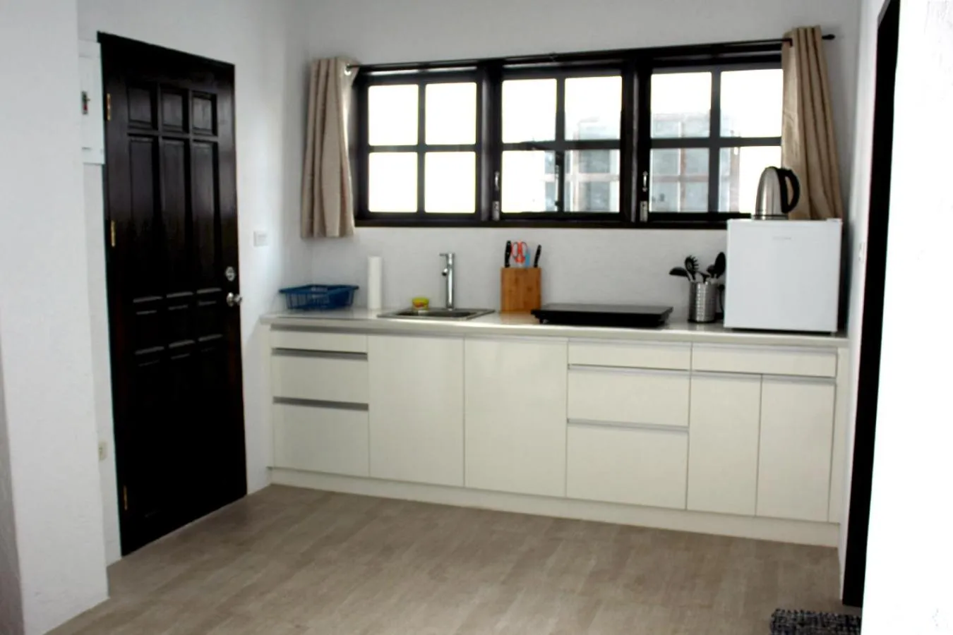 Kitchen or kitchenette in Sentro Suites Siargao