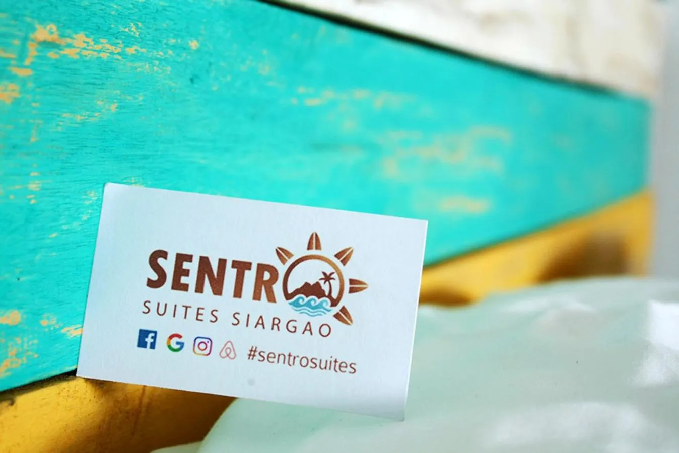 Property logo or sign in Sentro Suites Siargao