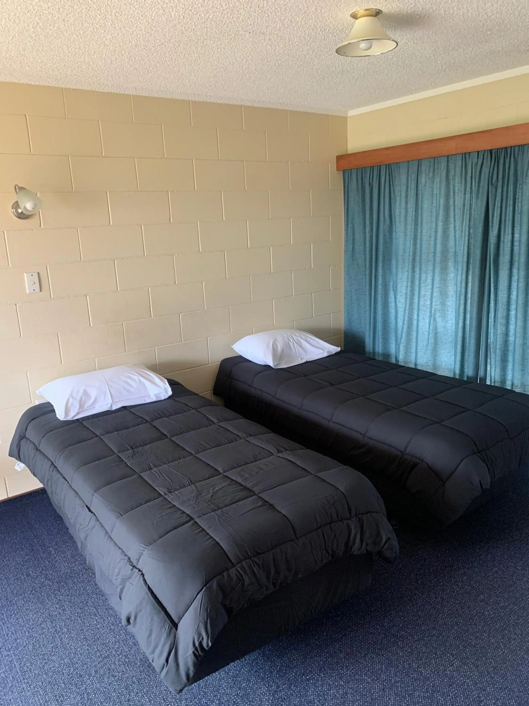 Bed in Wayfarer Motel