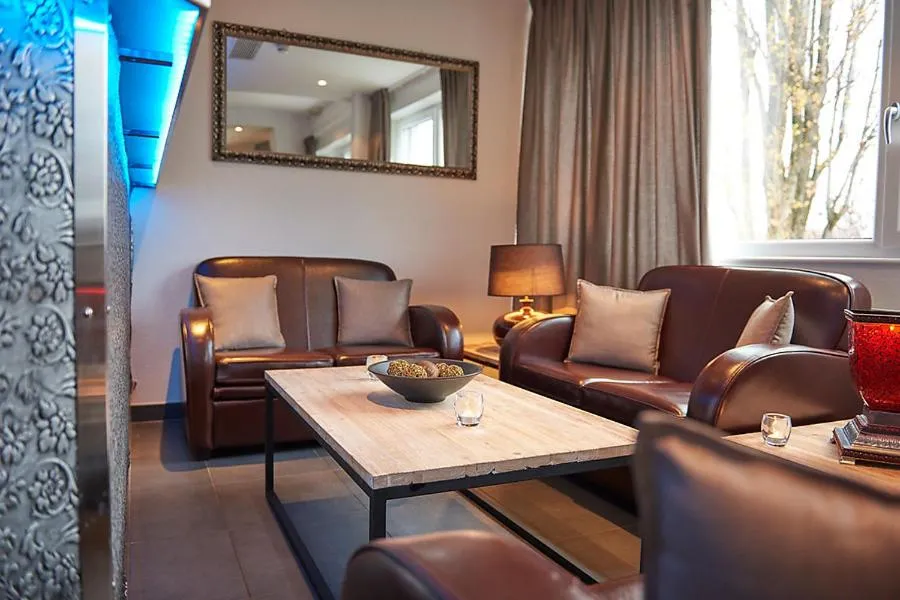 Communal lounge/ TV room in Le Leman Hotel