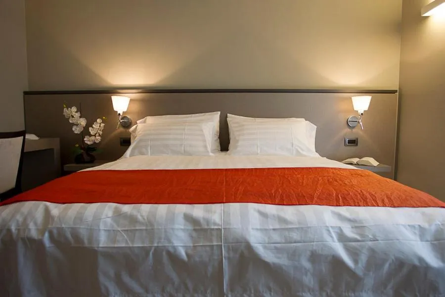 Bed in Zara Rooms & Suites