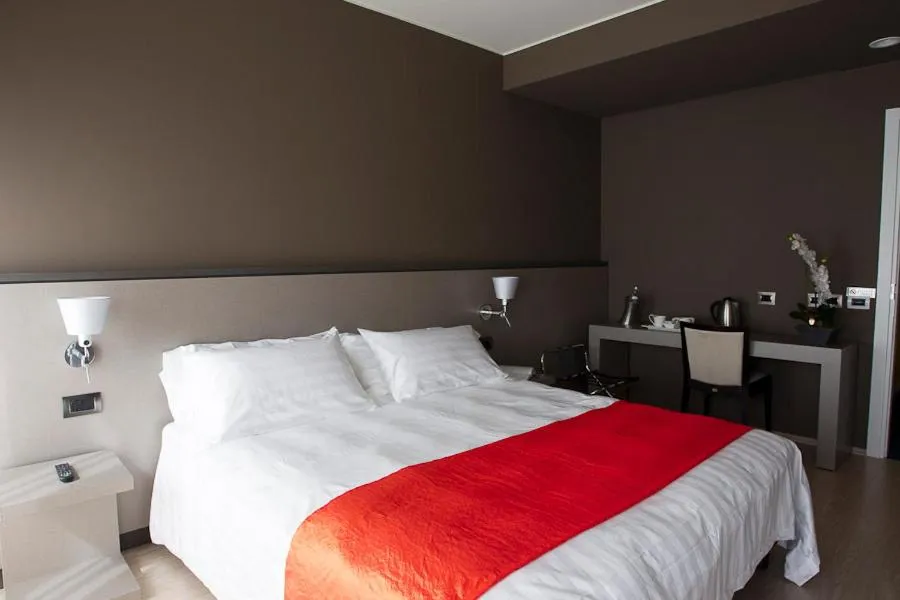 Bed in Zara Rooms & Suites