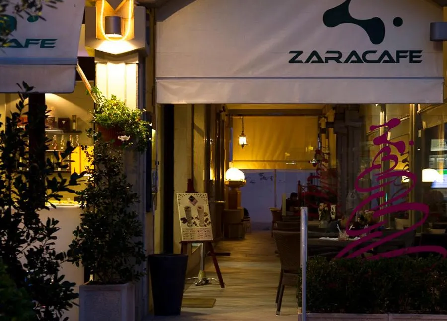 Property logo or sign in Zara Rooms & Suites