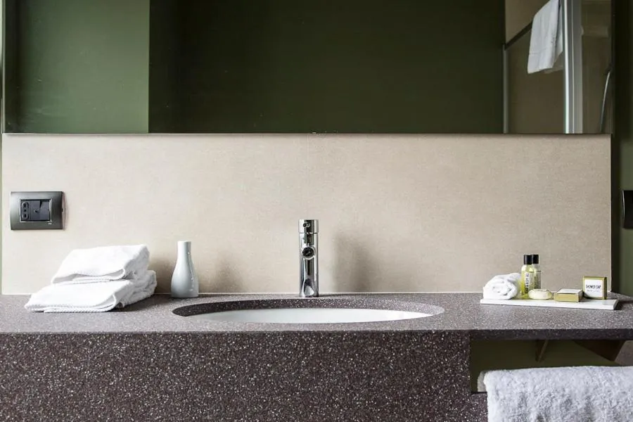 Bathroom in Zara Rooms & Suites