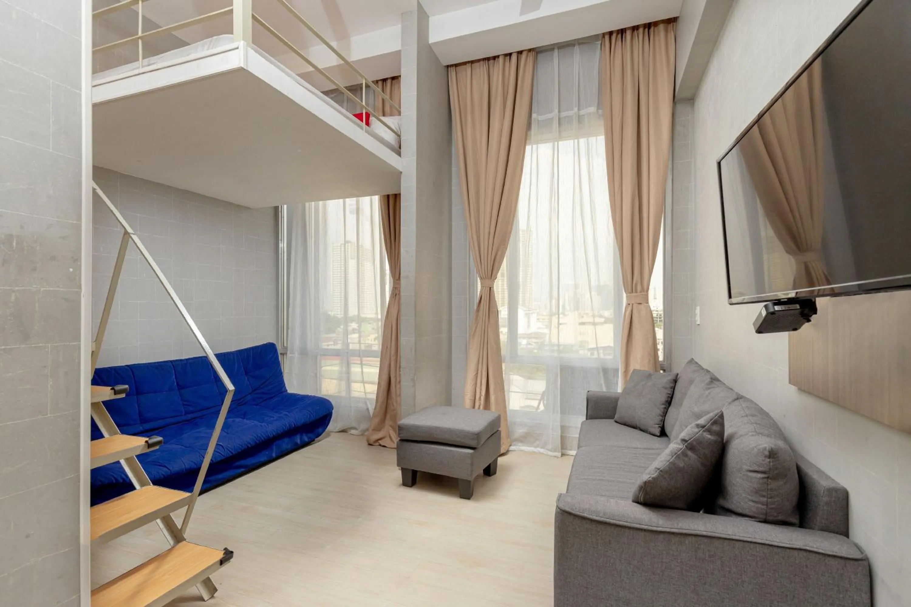 Seating area in Selah Pods Hotel Manila