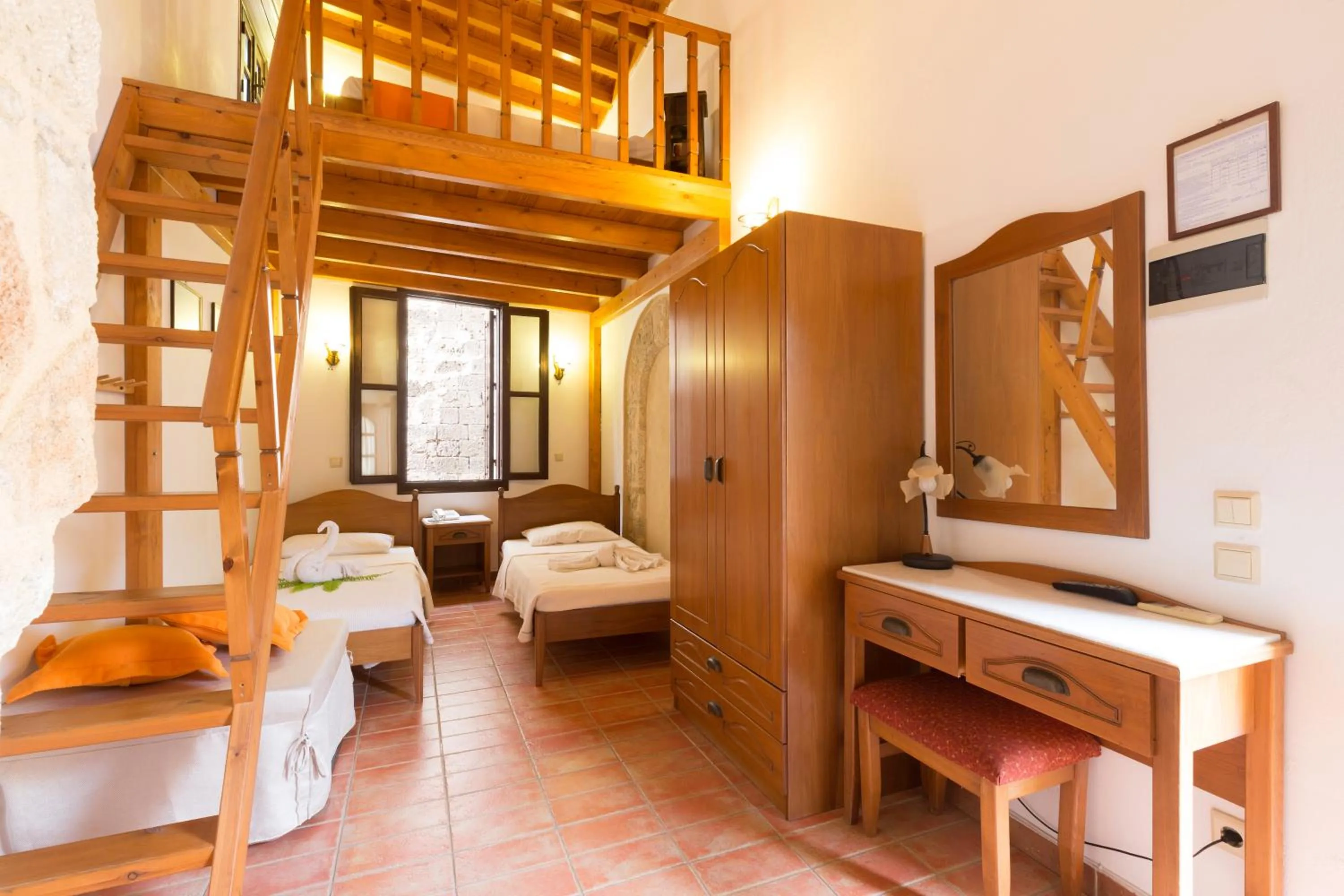 Bed in Camelot Traditional & Classic Hotel