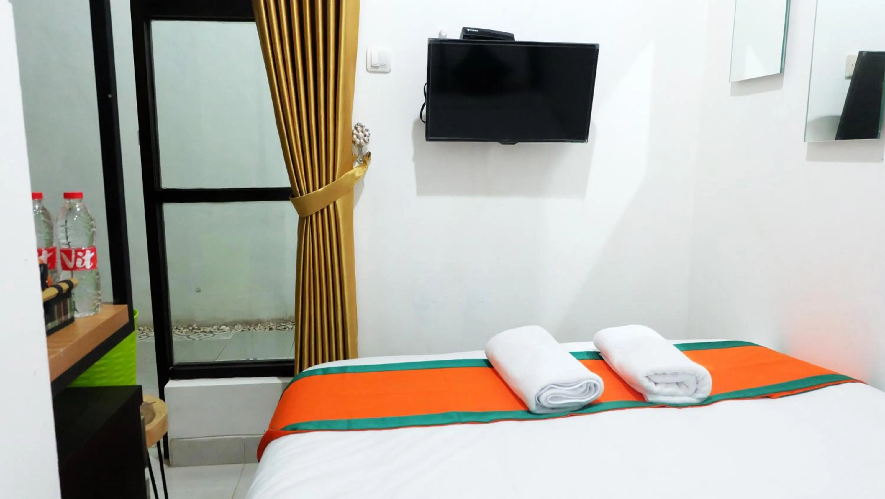 Bed in Hotel Jogja Kili Suci By Simply Homy