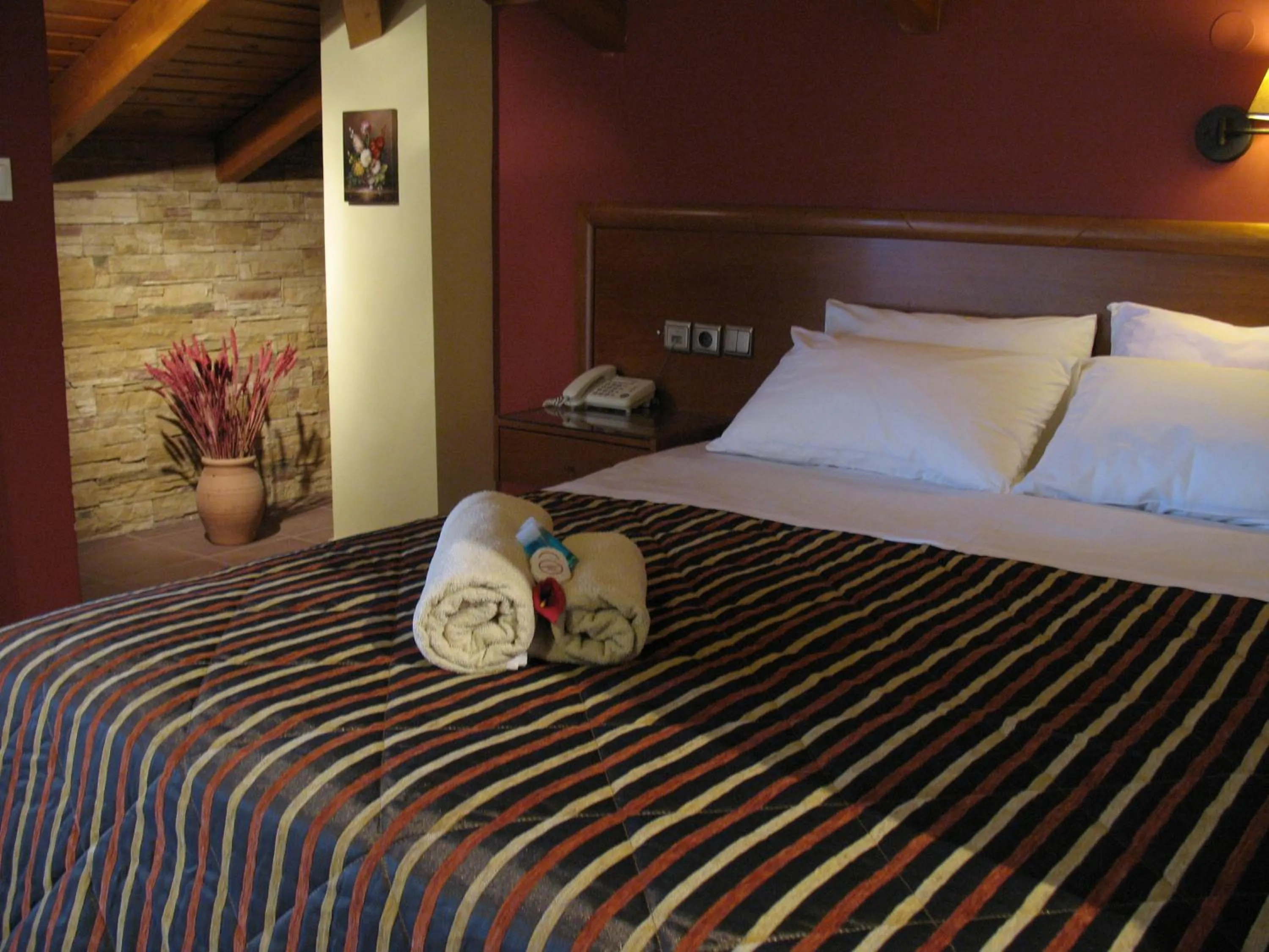Bed in Hotel Prigipikon Suites and sofites