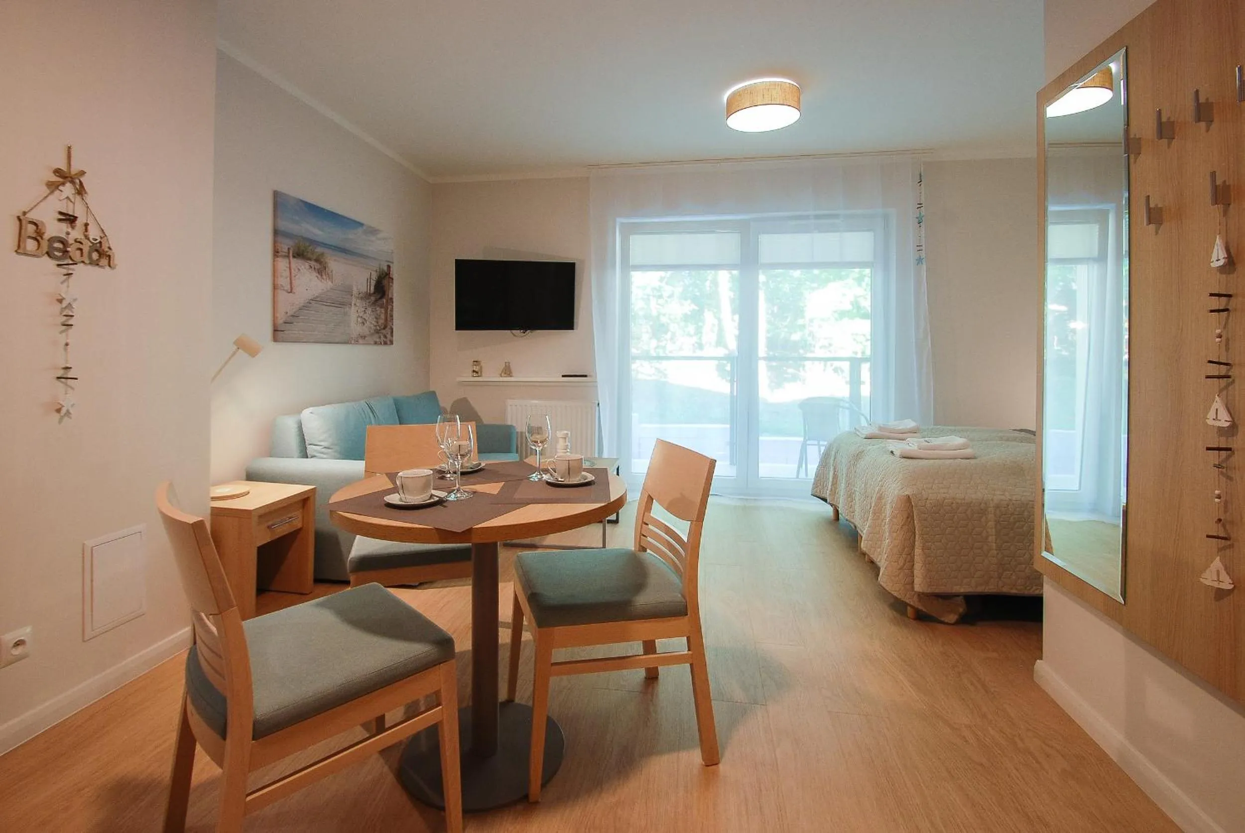 Seating area, Bed in Osiedle Cesarskie Apartamenty - Parking - Apartamenty Bryza