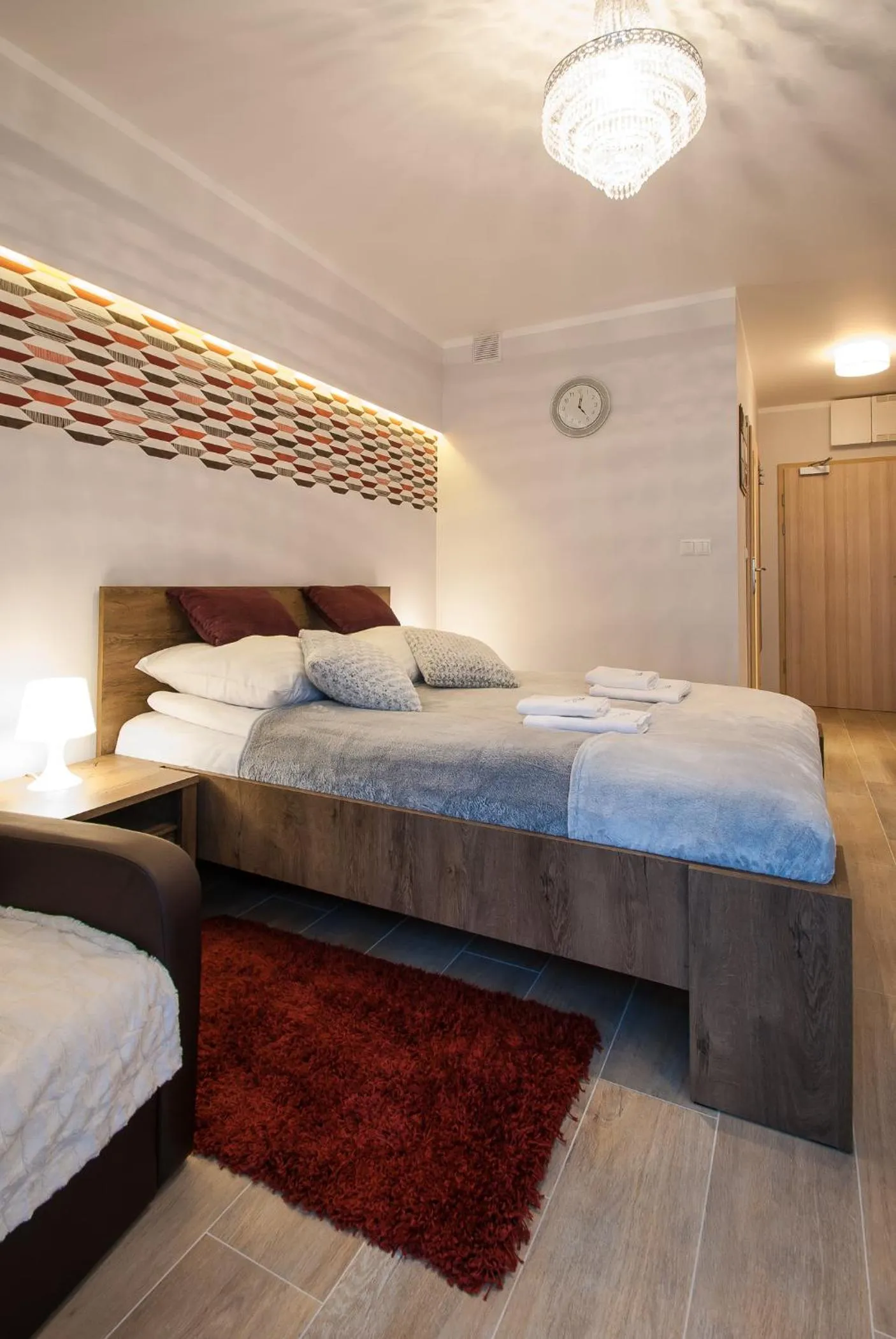 Seating area, Bed in Osiedle Cesarskie Apartamenty - Parking - Apartamenty Bryza