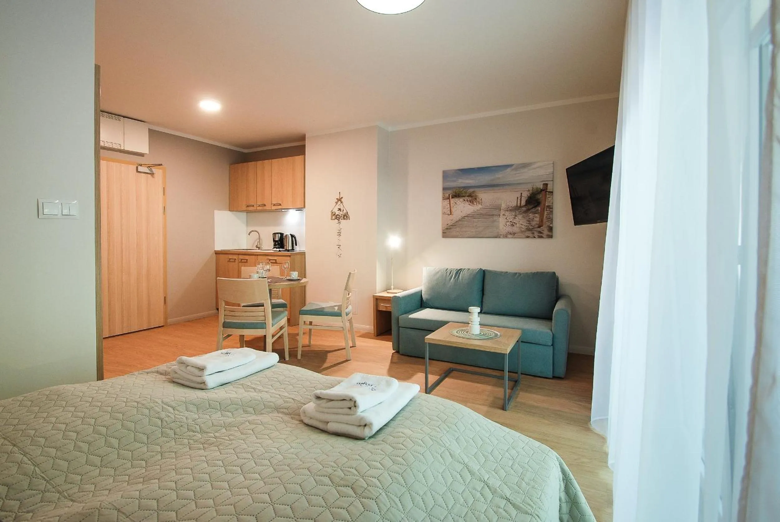 Seating area, Bed in Osiedle Cesarskie Apartamenty - Parking - Apartamenty Bryza