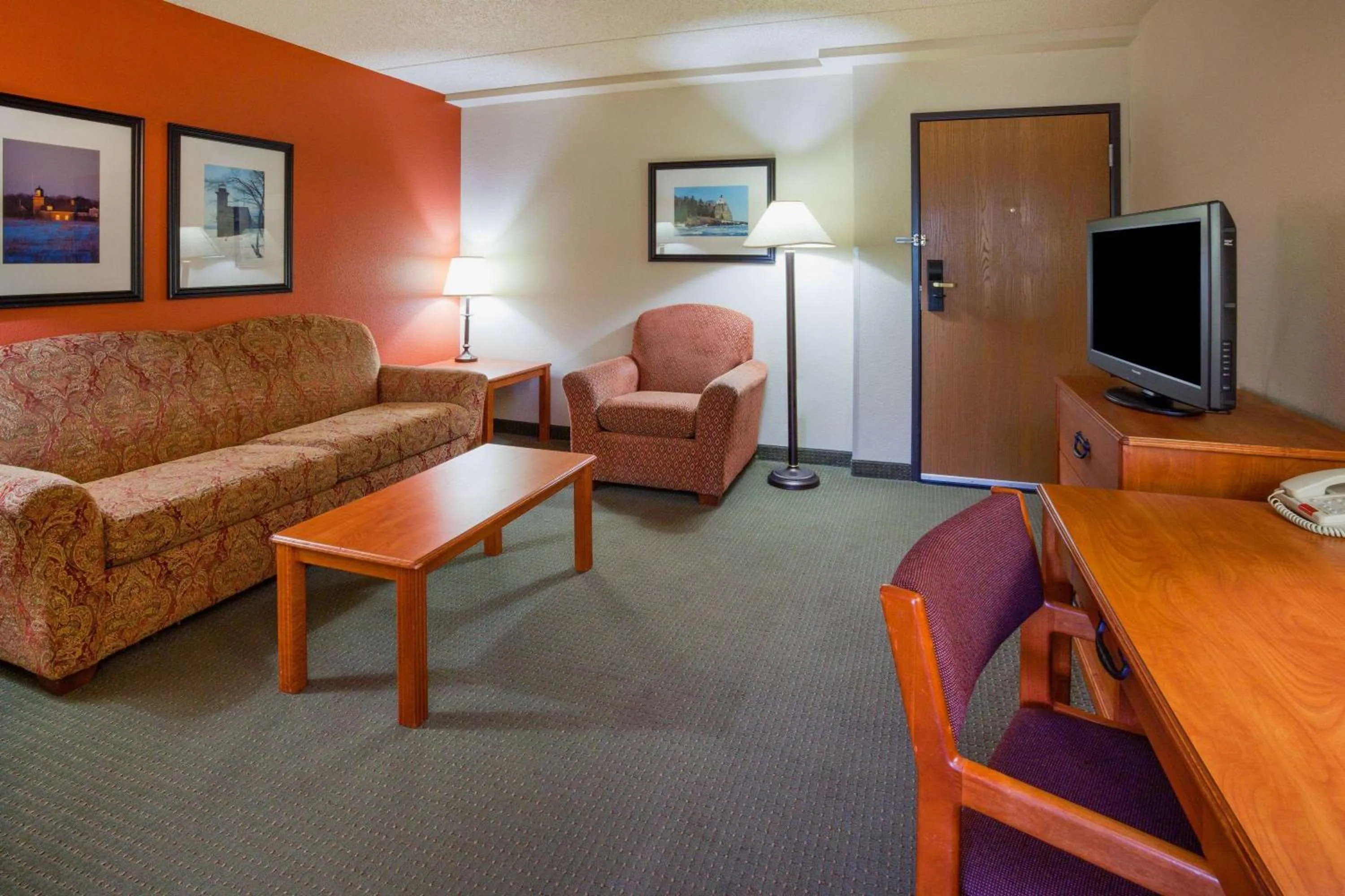 Living room in AmericInn by Wyndham Wetmore Munising