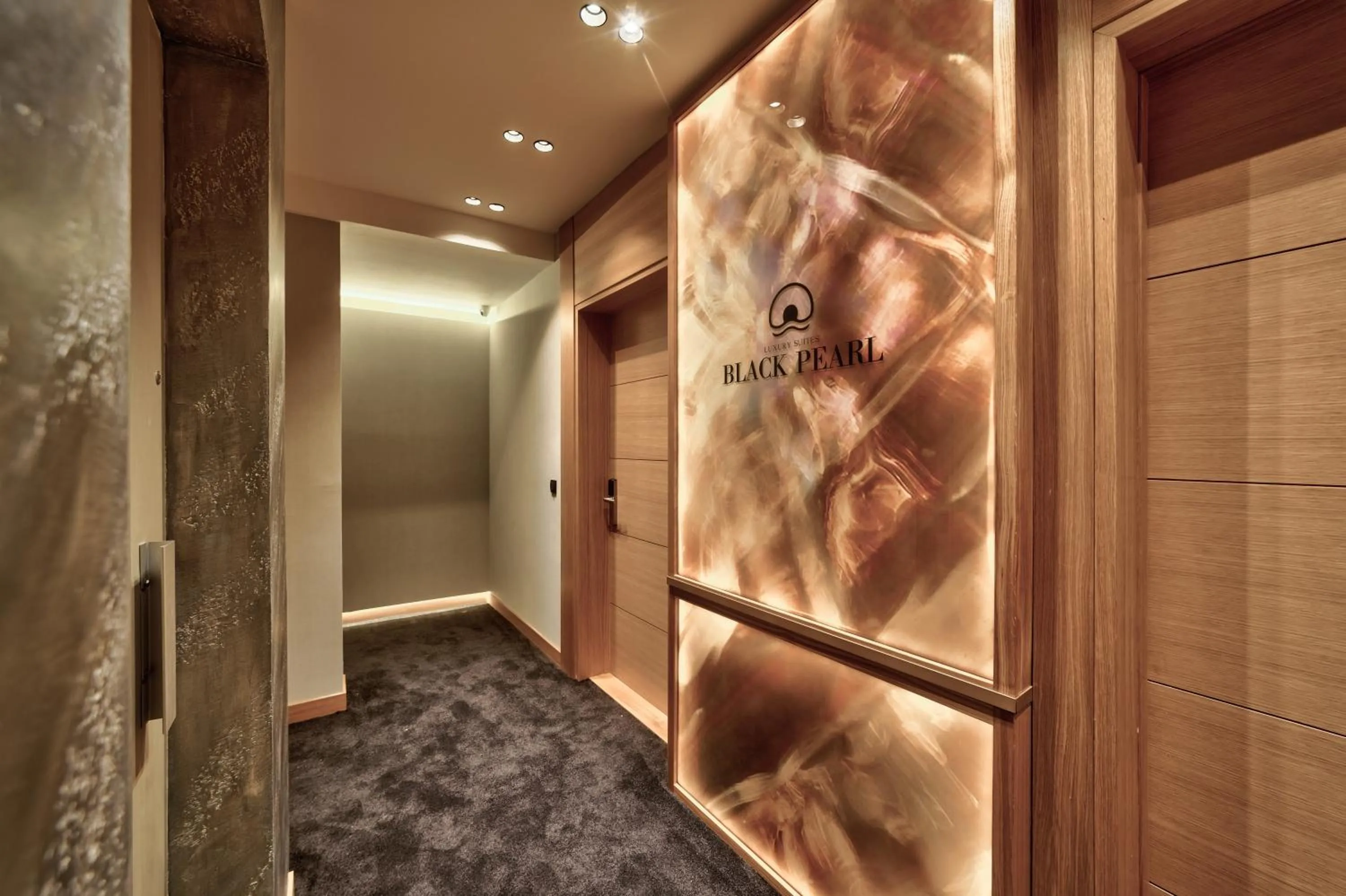 Property logo or sign in Black Pearl Luxury Suites